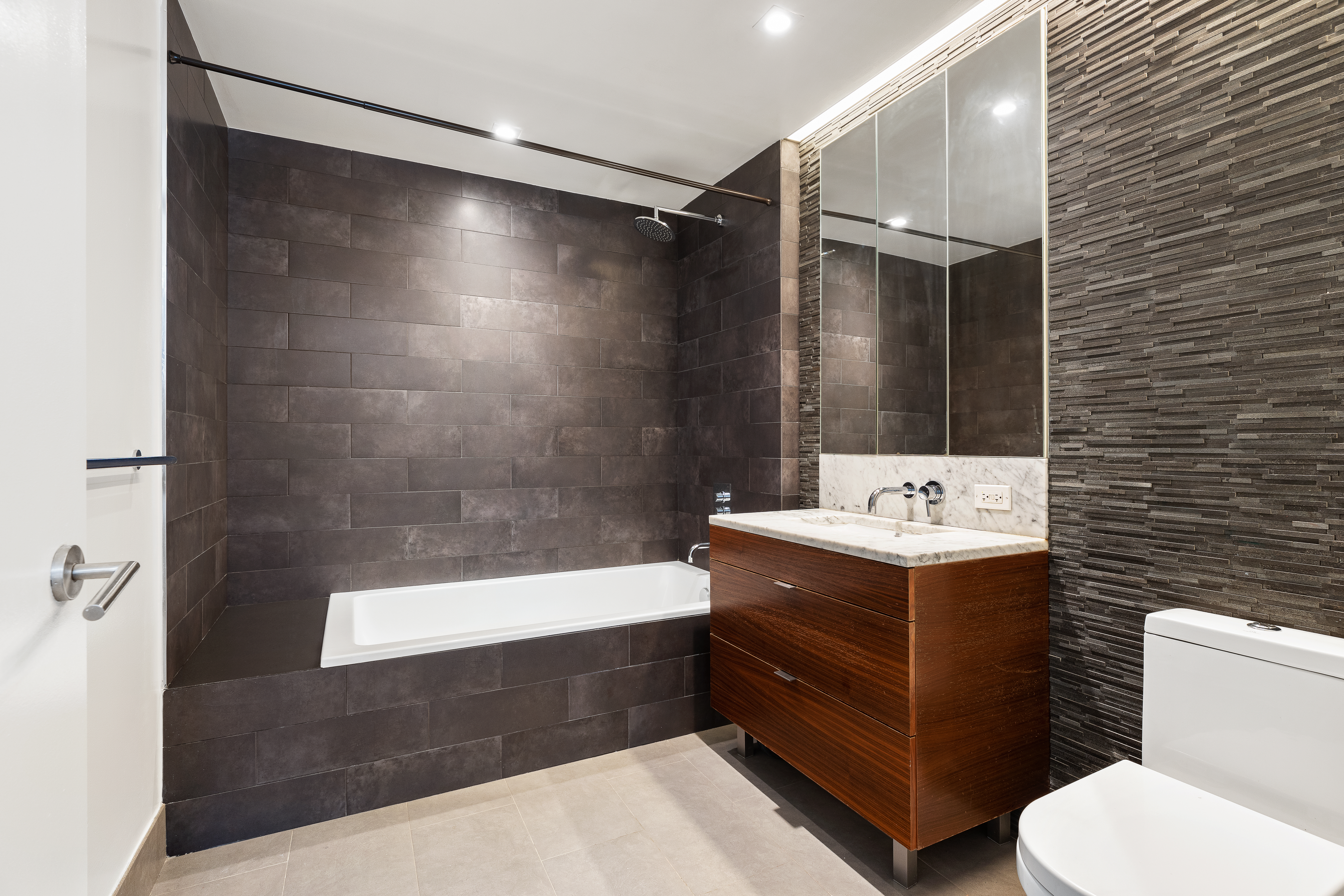 205 Water Street, Unit 7N Brooklyn, NY 11201 - Photo 5 of 11 a bathroom with a sink a toilet and shower