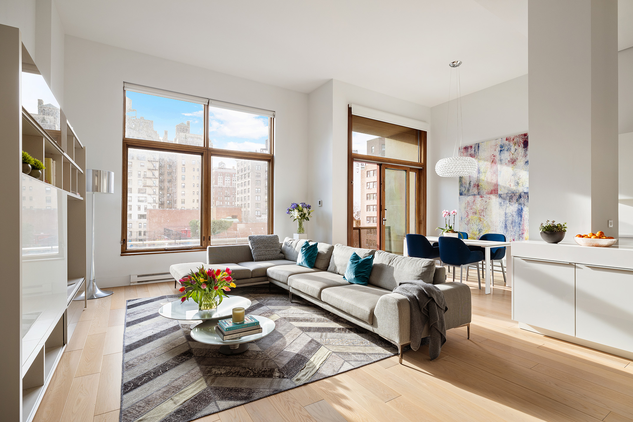 1080 Madison Avenue, Unit 6B Manhattan, NY 10028 - Photo 1 of 11 a living room with furniture and a large window