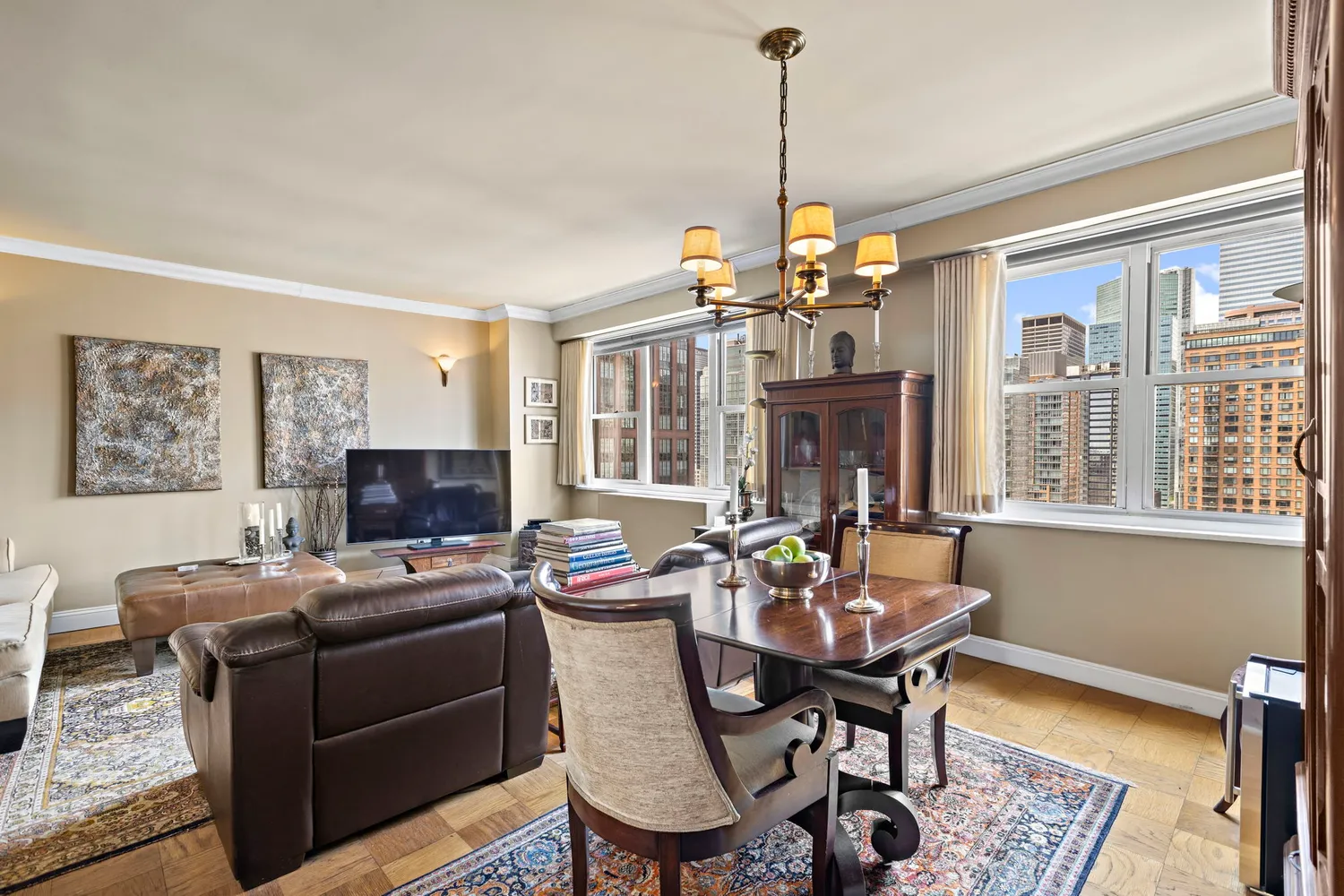 a living room with furniture and a chandelier