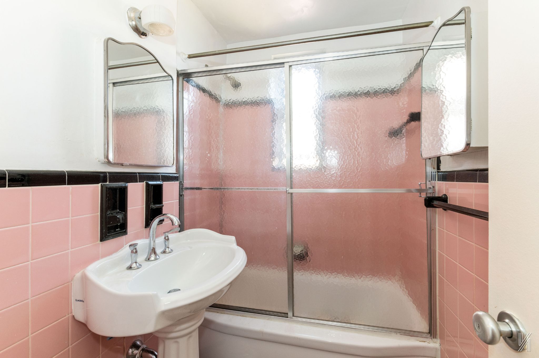 33-45 92nd Street, Unit 5G Queens, NY 11372 - Photo 6 of 8 a bathroom with a sink and shower
