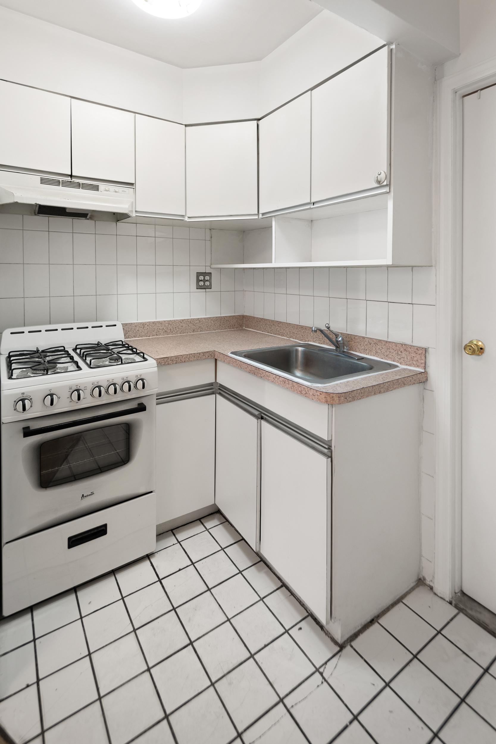 101 Allen Street, Unit 2D Manhattan, NY 10002 - Photo 3 of 4 a kitchen with cabinets appliances and a sink