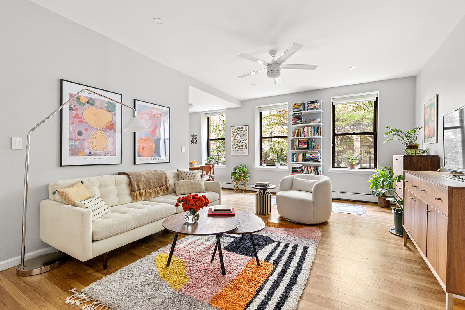 295 St Johns Place, Unit 1C Brooklyn, NY 11238 - Photo 3 of 17 a living room with furniture and windows
