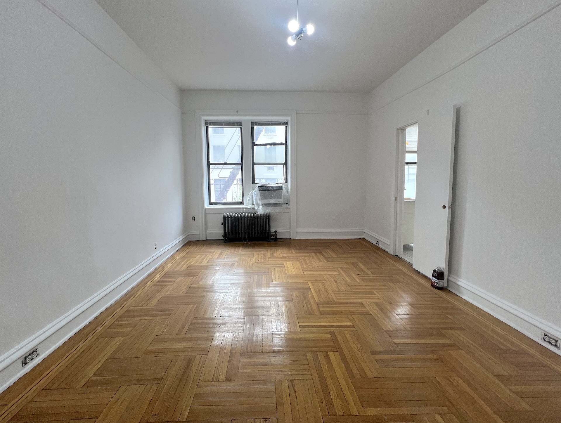 59 Livingston Street, Unit 3A Brooklyn, NY 11201 - Photo 5 of 19 a view of empty room with wooden floor and fan