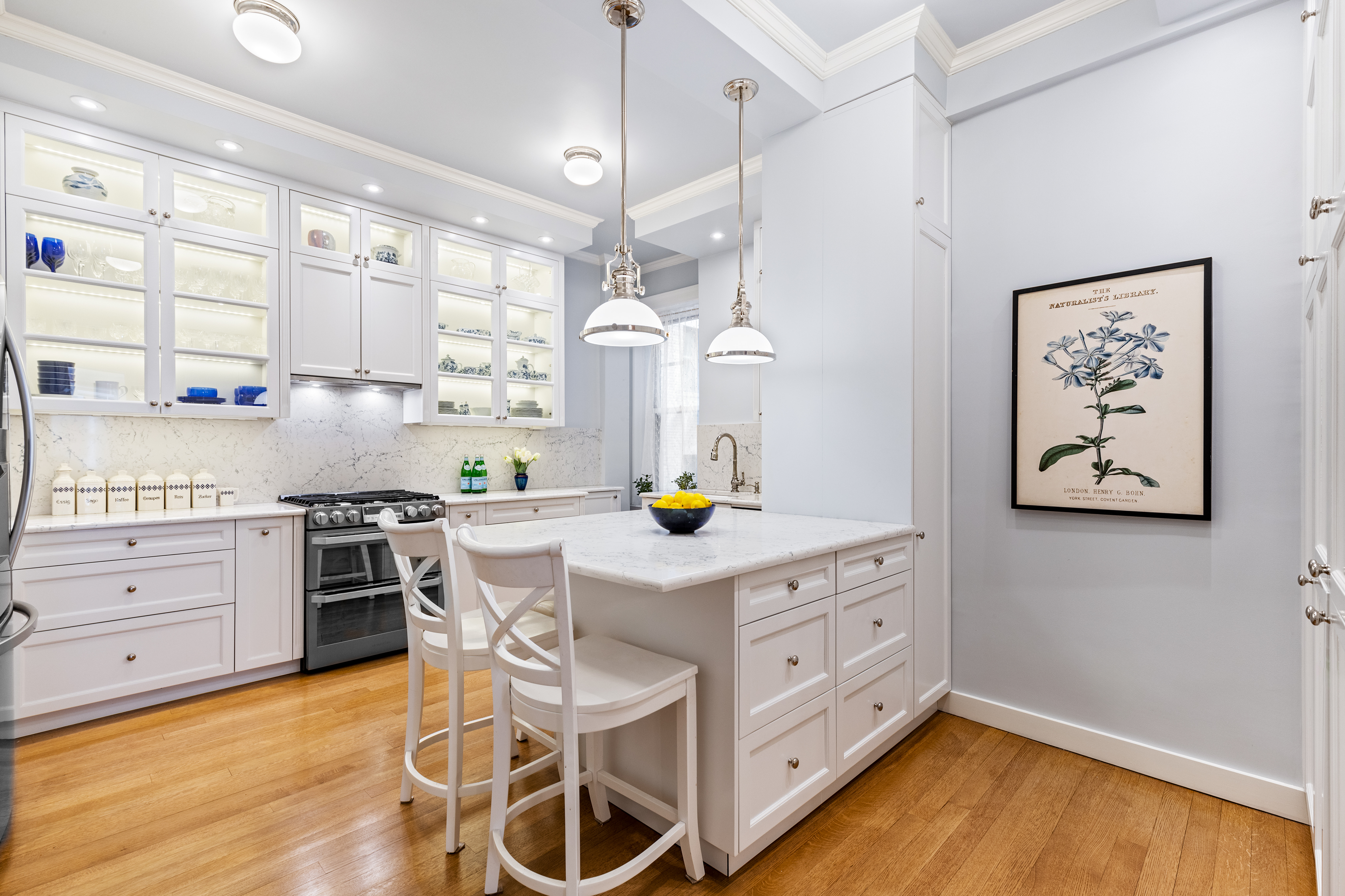 131 Riverside Drive, Unit 2C Manhattan, NY 10024 - Photo 5 of 17 a kitchen with stainless steel appliances a stove a sink and a refrigerator
