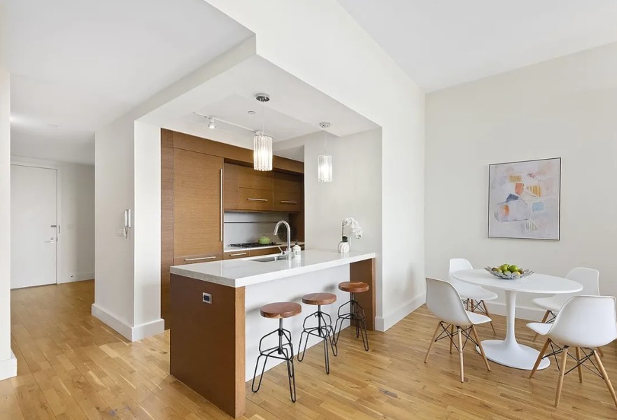 360 Furman Street, Unit 723 Brooklyn, NY 11201 - Photo 3 of 41 a workspace with furniture and wooden floor