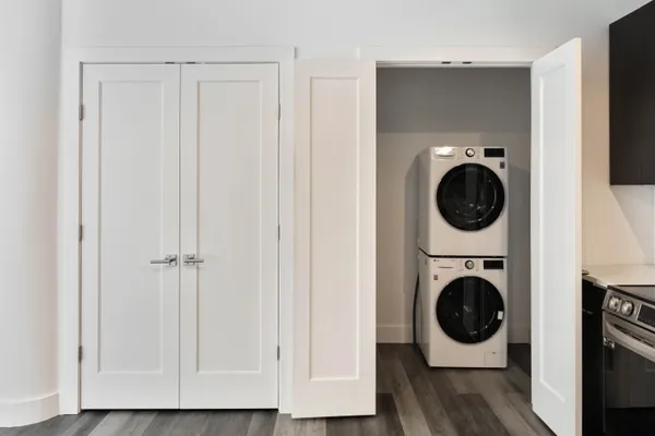a view of a hallway with washer and dryer