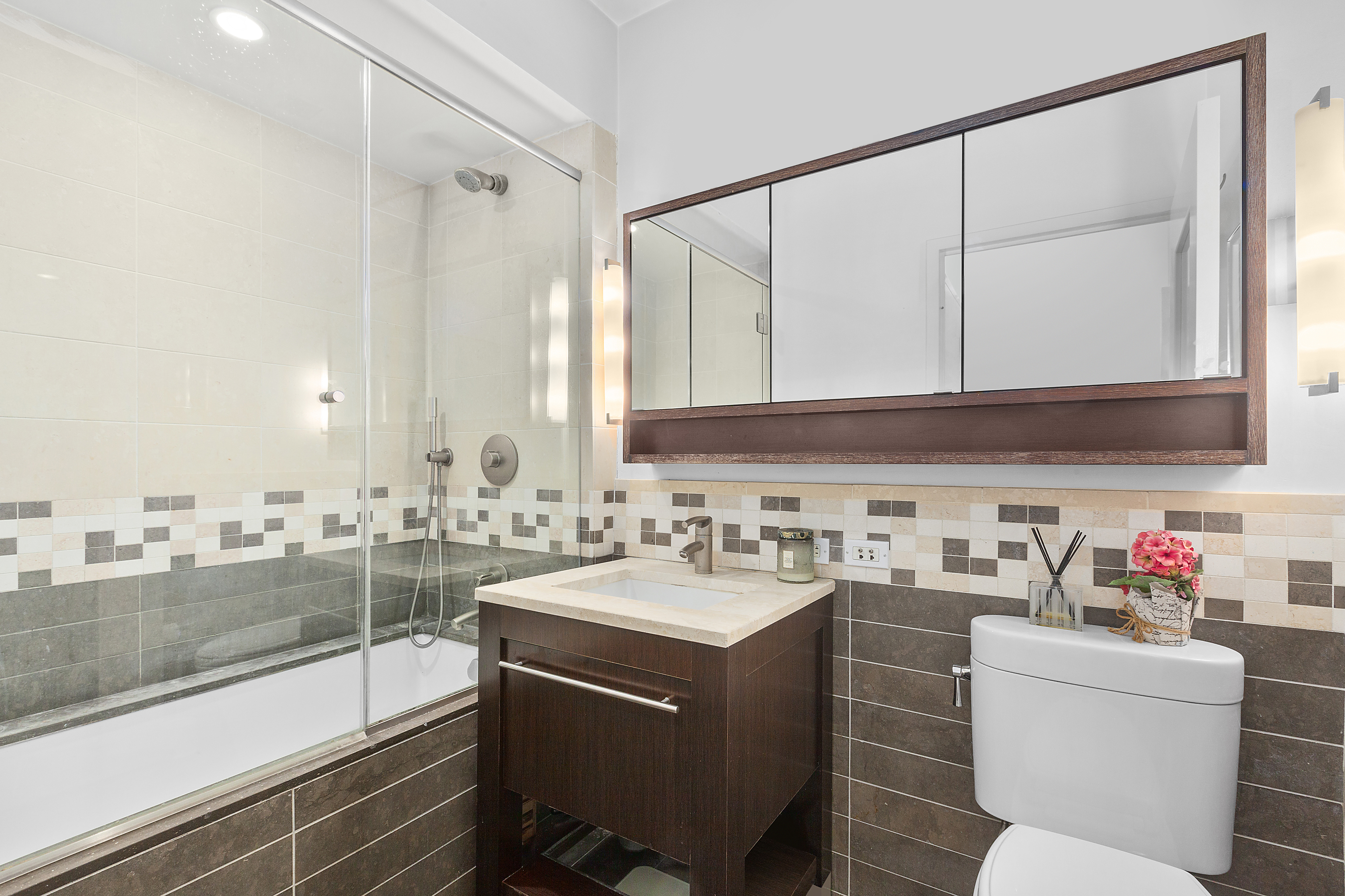 101 West 24th Street, Unit 4G Manhattan, NY 10011 - Photo 6 of 7 a room with a couch a sink and a view of living room