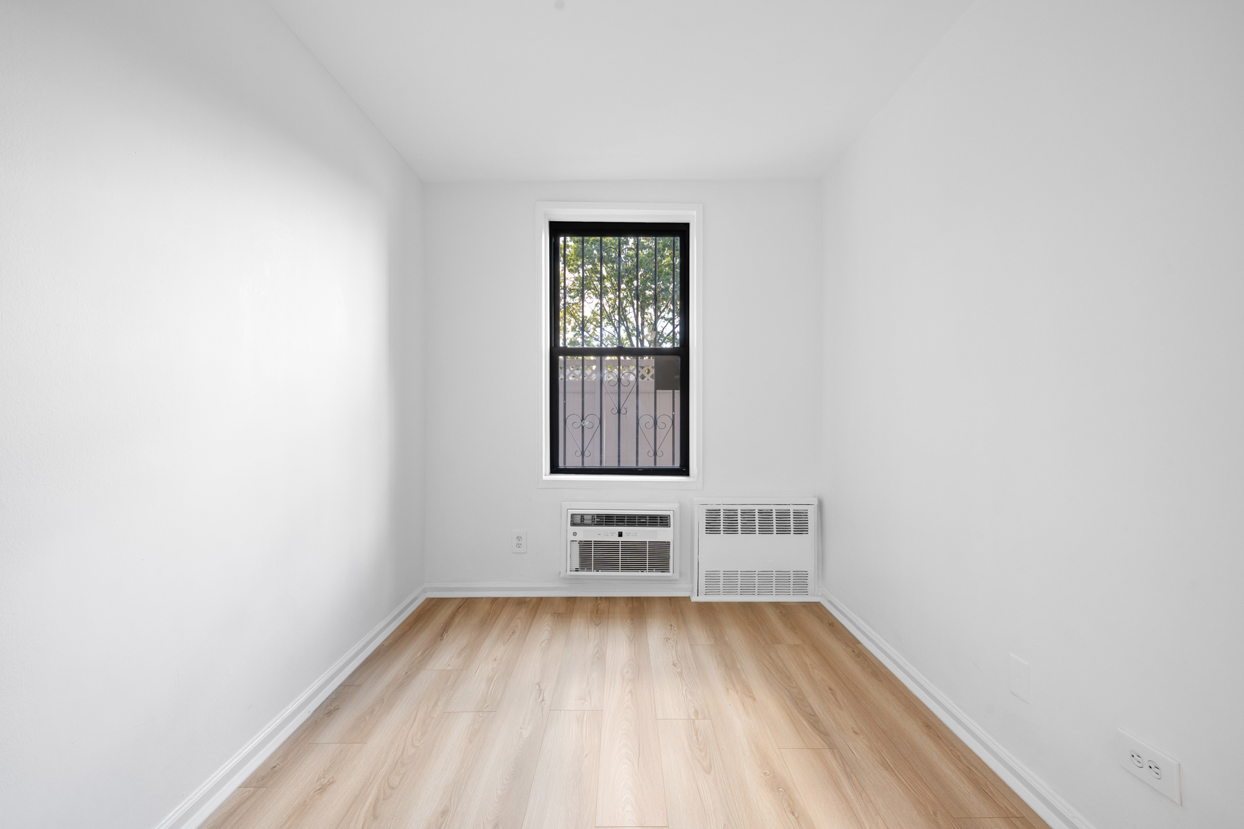 35-20 Leverich Street, Unit B226 Queens, NY 11372 - Photo 10 of 15 a view of room with hardwood