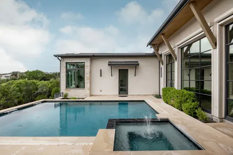 a view of pool with yard