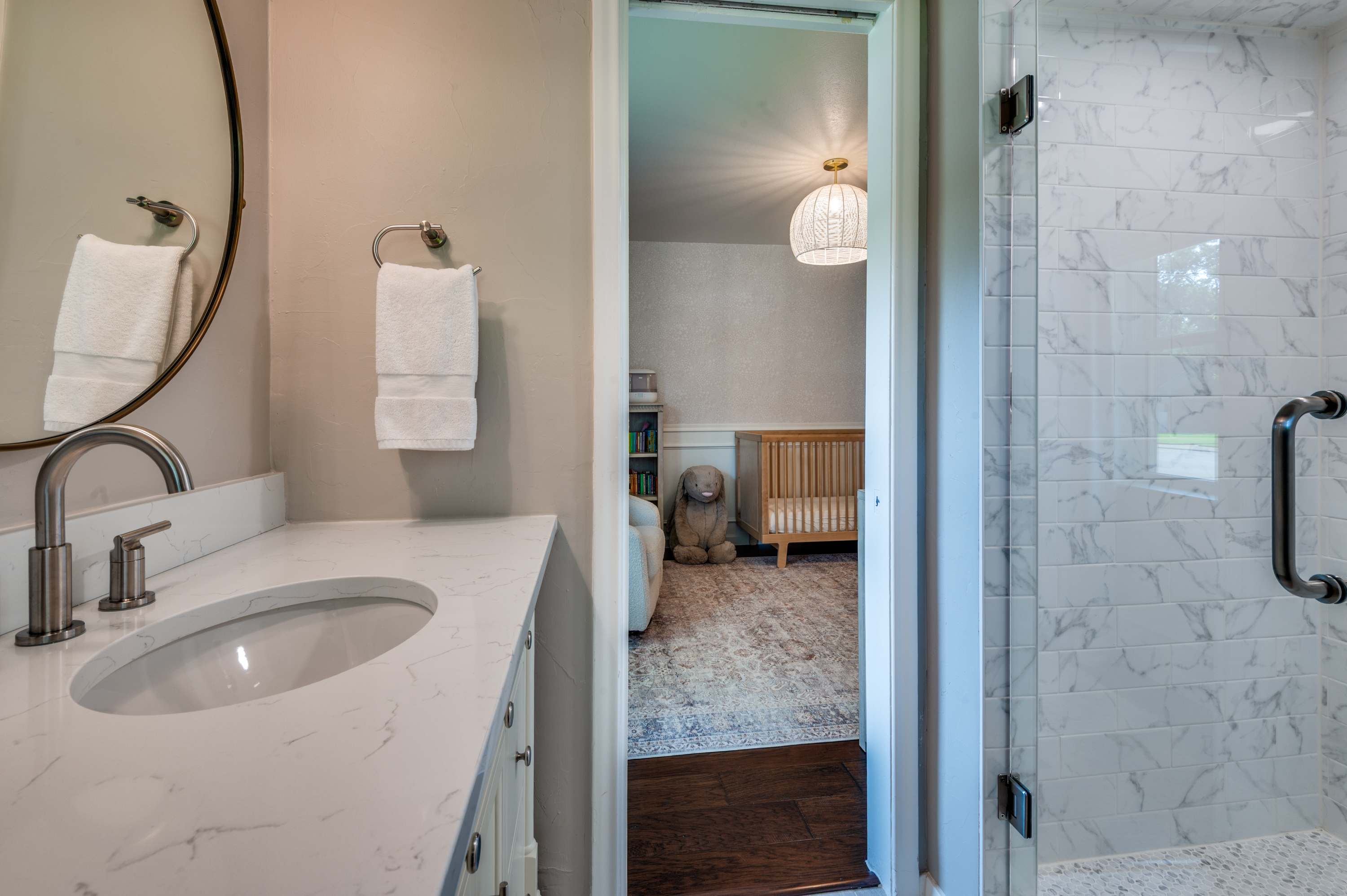 3363 Merrell Road Dallas, TX 75229 - Photo 21 of 29 a bathroom with a sink and a mirror