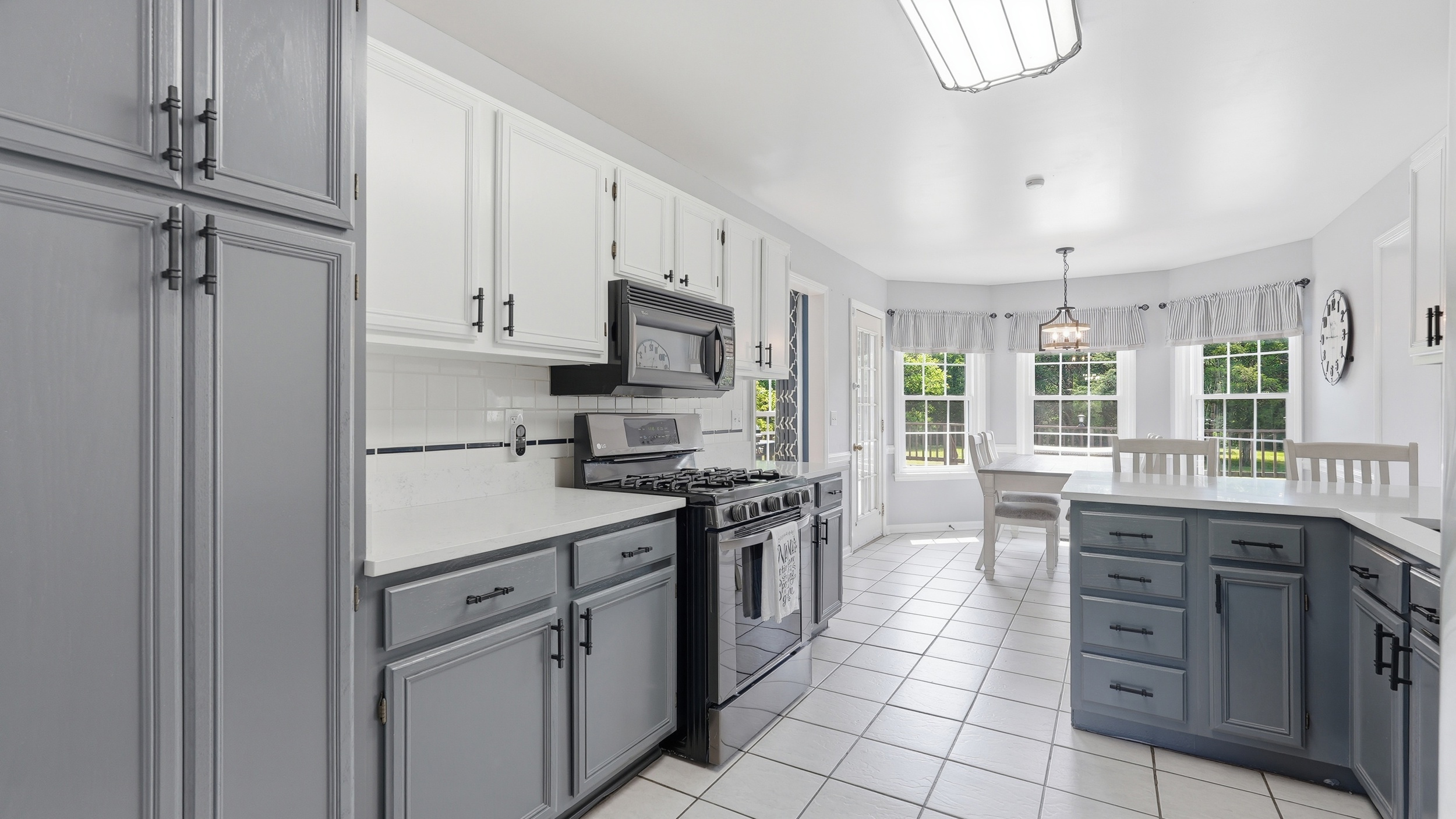 3630 West Trimble Road Milton, TN 37118 - Photo 6 of 9 a kitchen with stainless steel appliances granite countertop a stove and a refrigerator