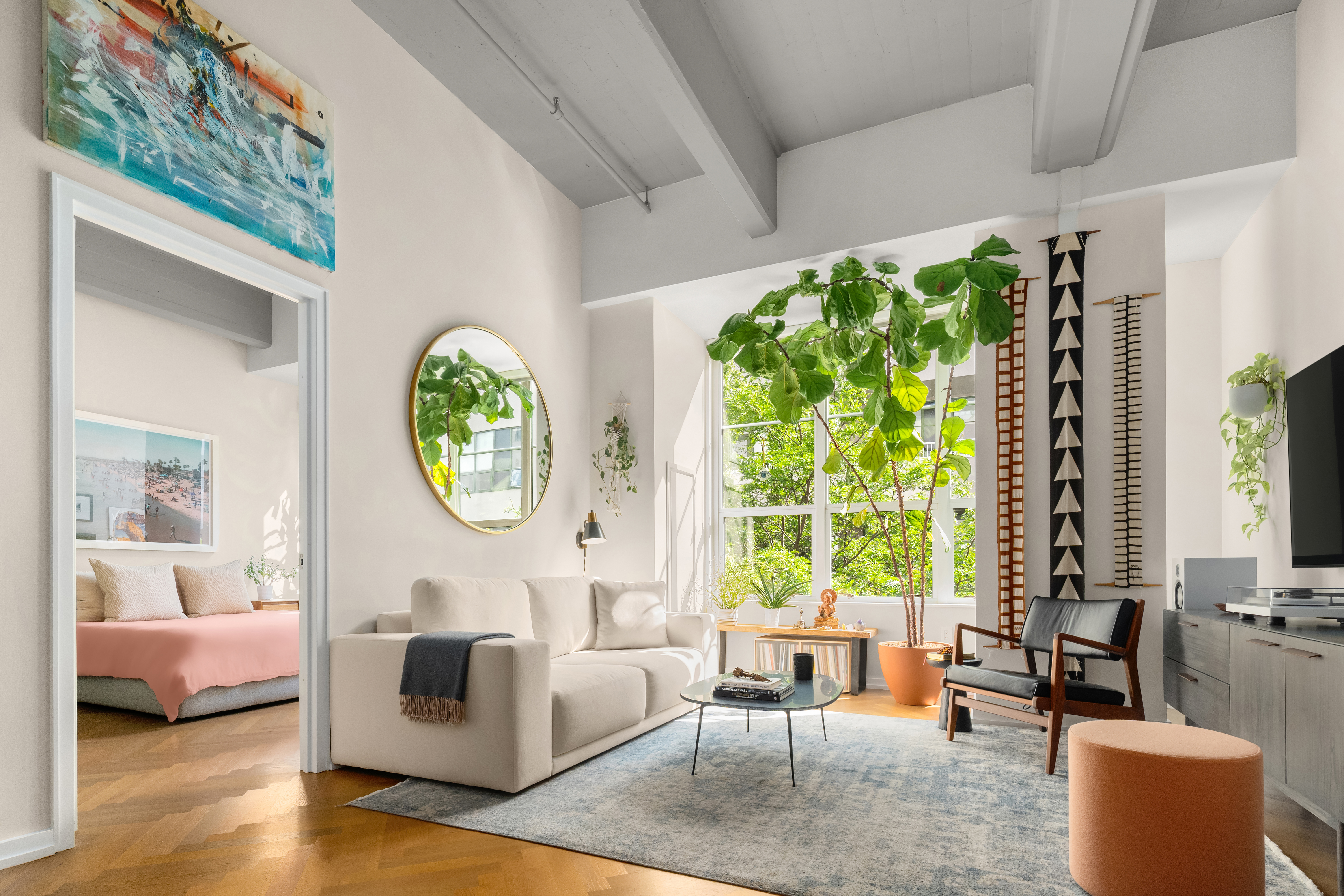 a living room with furniture and a large window
