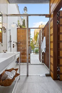 a view of a kitchen with a dining table and chairs