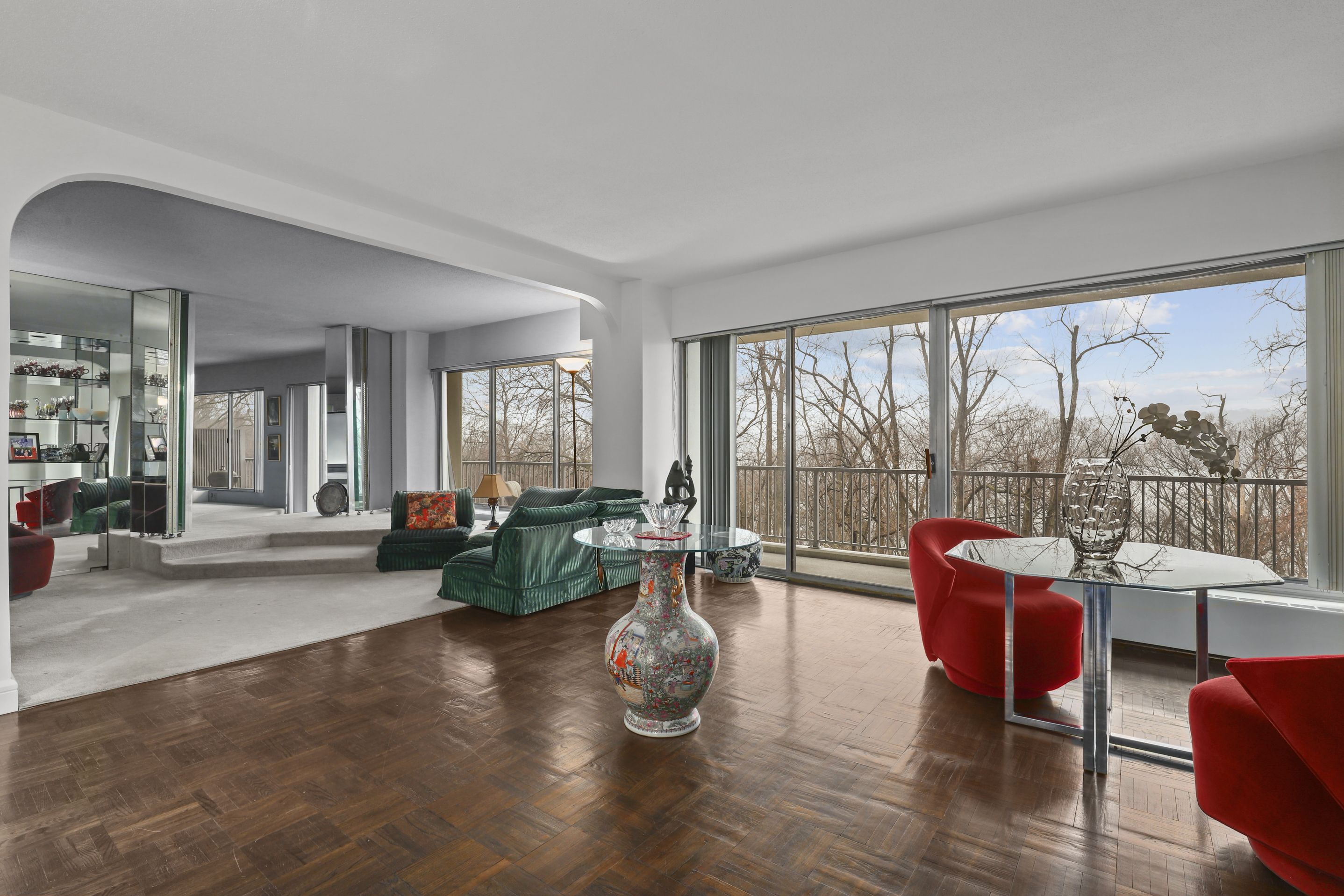 4455 Douglas Avenue, Unit 3FE Bronx, NY 10471 - Photo 2 of 53 a living room with furniture and floor to ceiling windows
