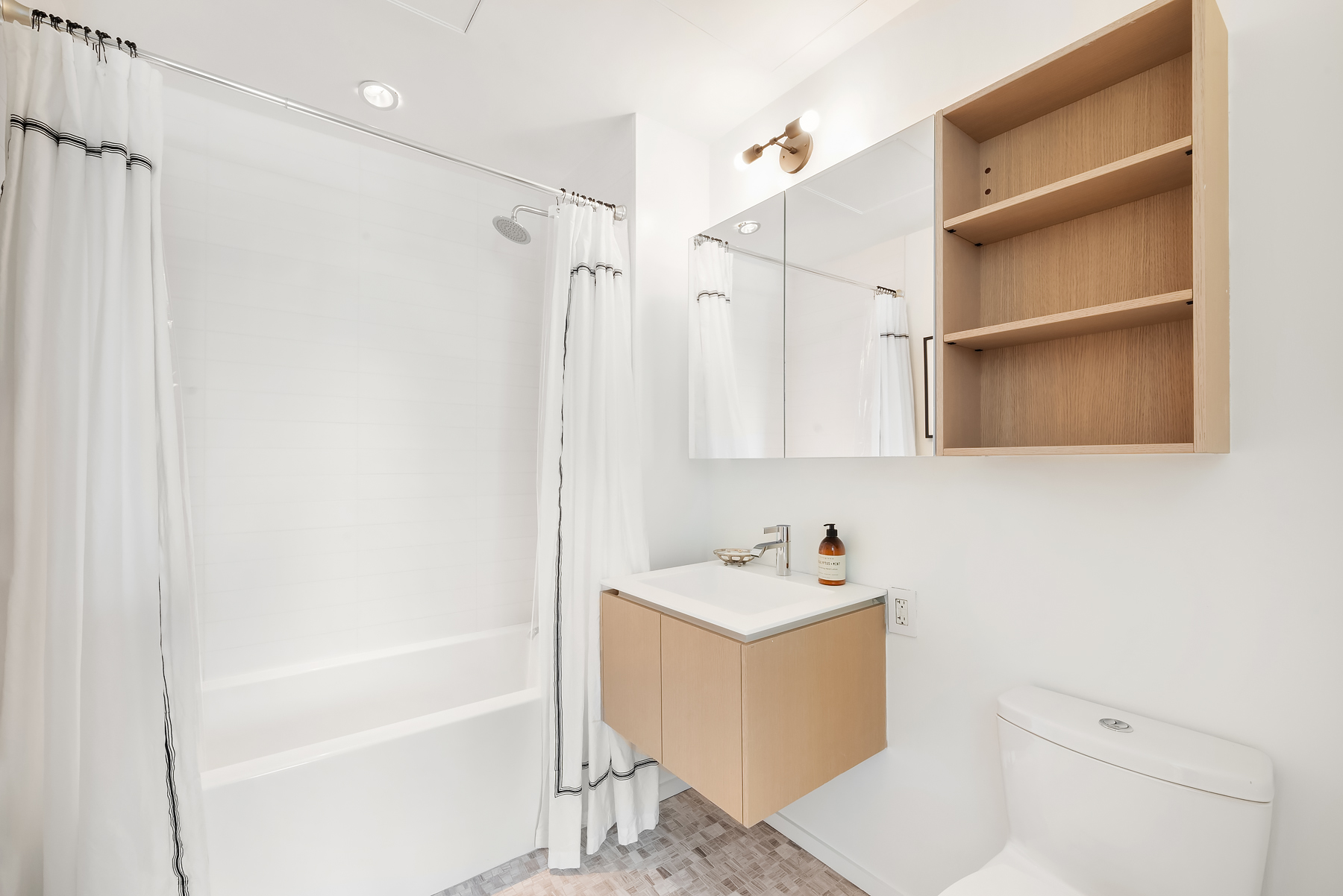 1 John Street, Unit 9D Brooklyn, NY 11201 - Photo 10 of 20 a bathroom with a sink a toilet and shower