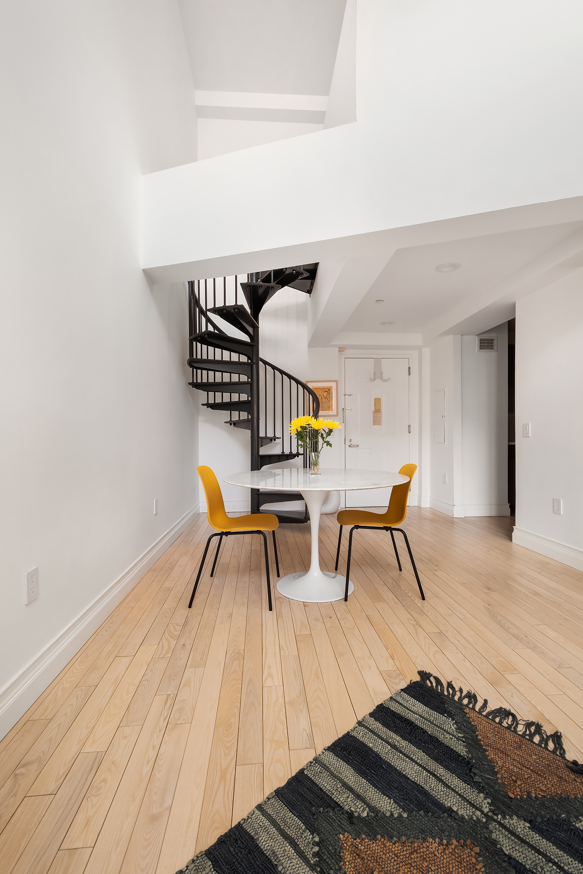 163 St Nicholas Avenue, Unit PH7A Manhattan, NY 10026 - Photo 2 of 11 a living room with furniture and a table
