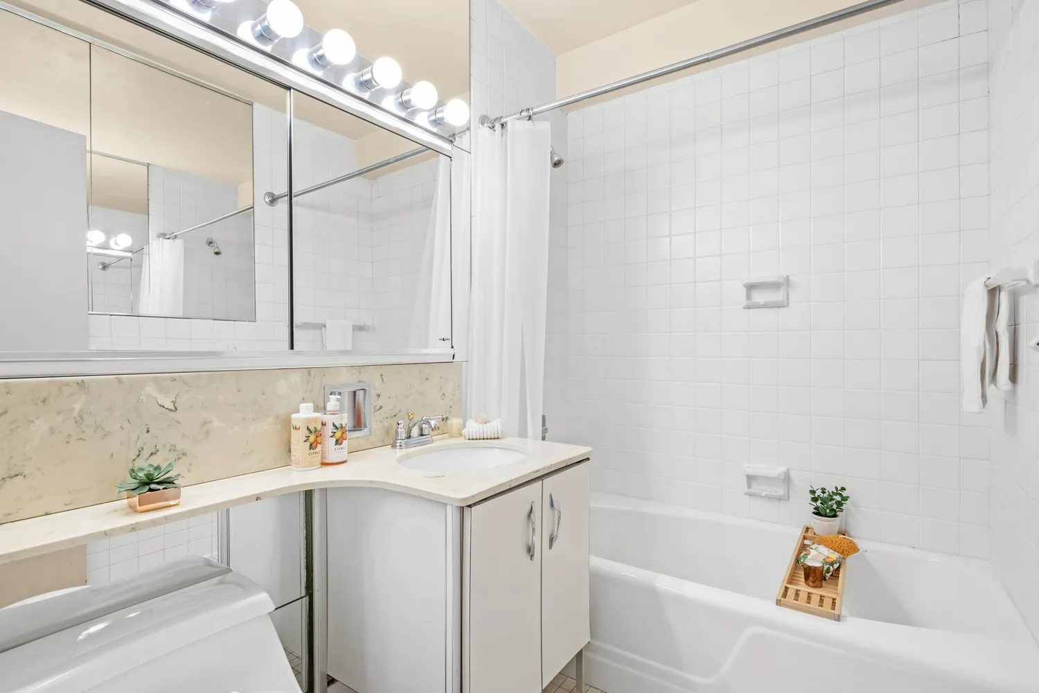 a bathroom with a sink a bath tub and a shower