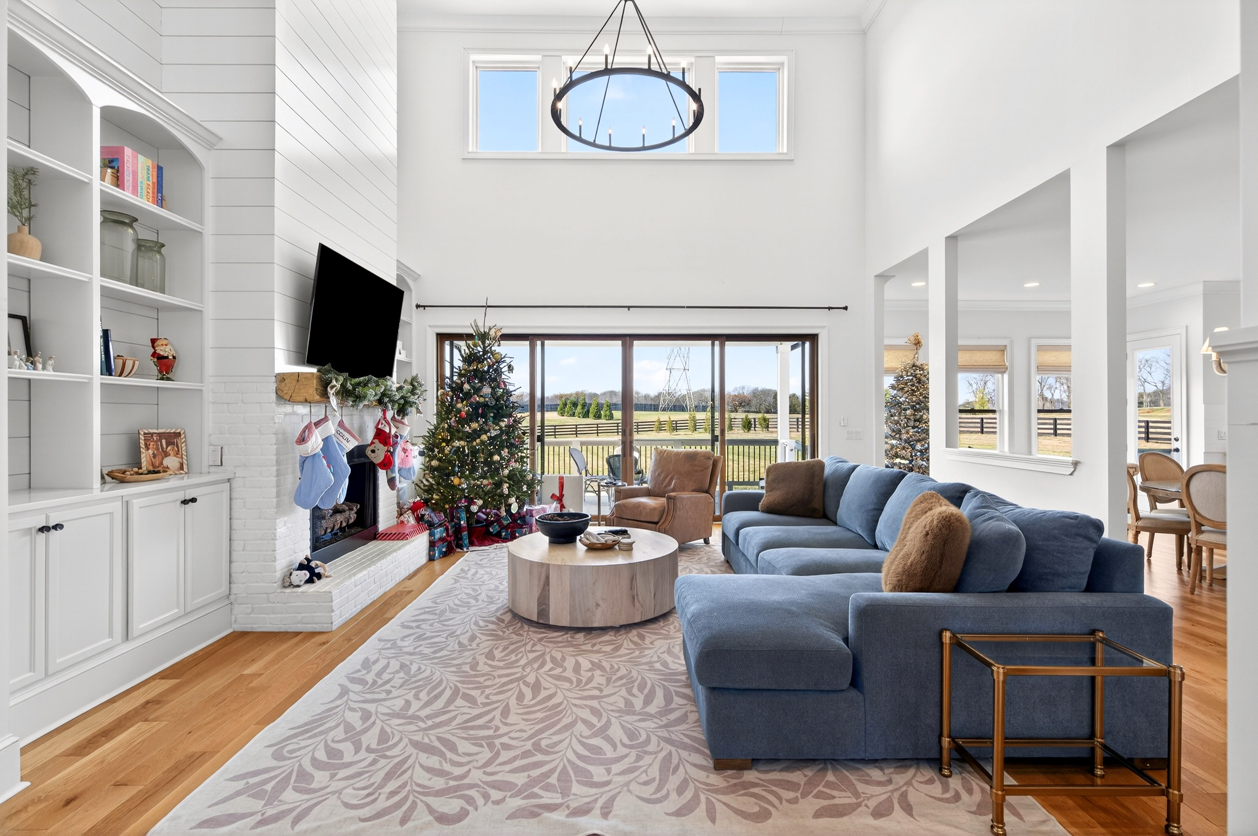 1703 Swansons Rdg Drive Franklin, TN 37064 - Photo 17 of 67 a living room with furniture a flat screen tv and a floor to ceiling window