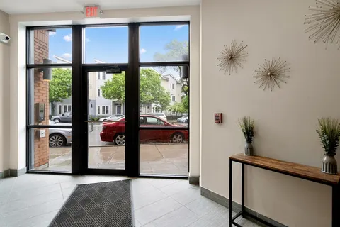 a view of a hallway and a potted plant