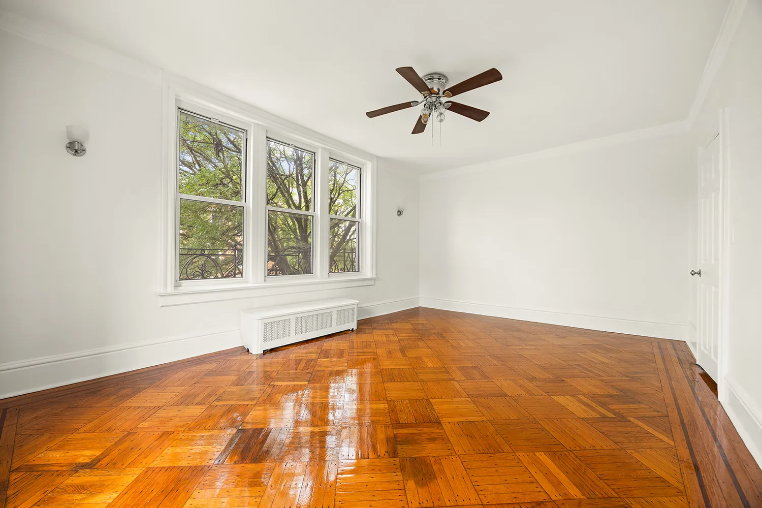 a view of an empty room with a window