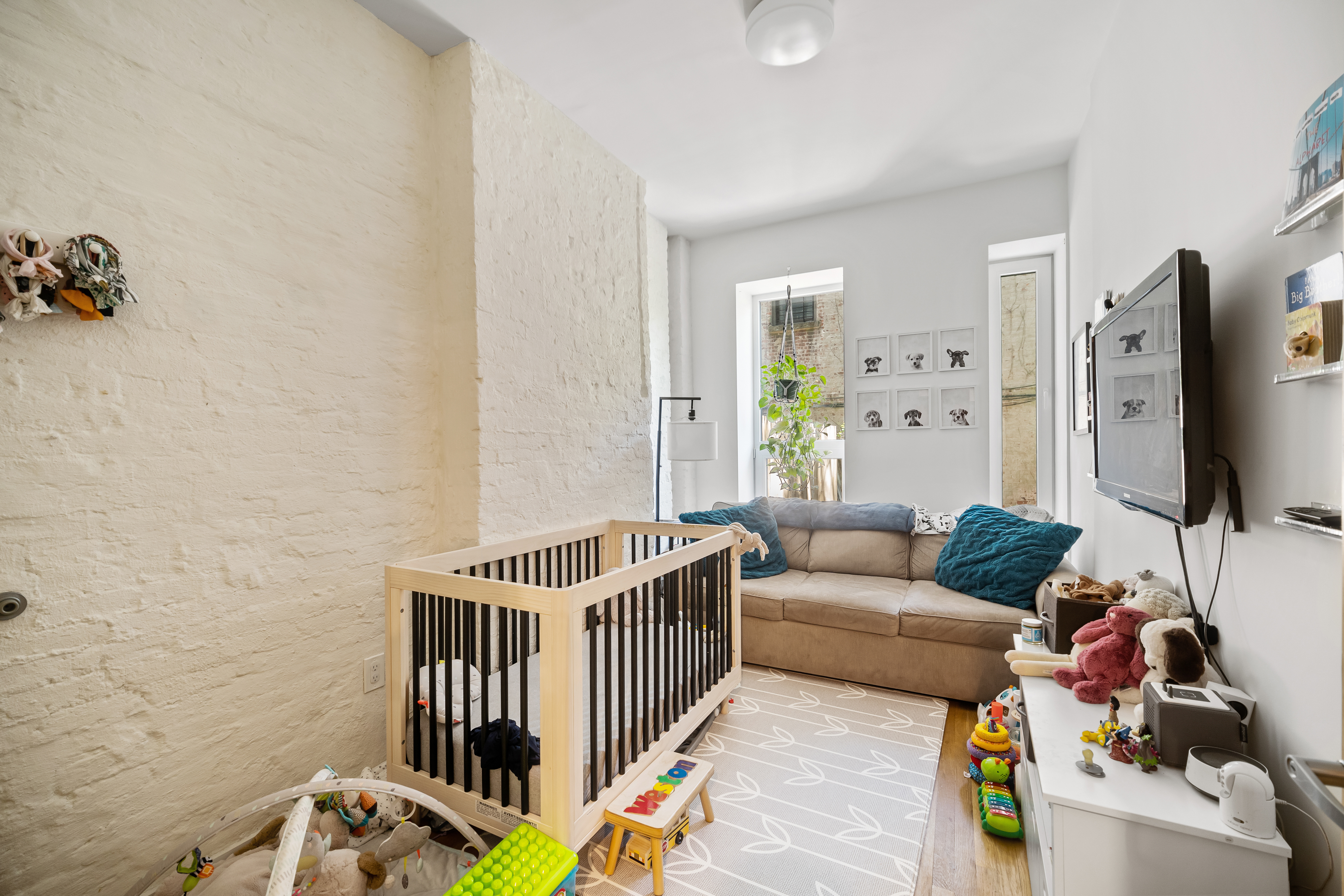 353 12th Street, Unit 2 Brooklyn, NY 11215 - Photo 5 of 17 a living room with furniture and a flat screen tv
