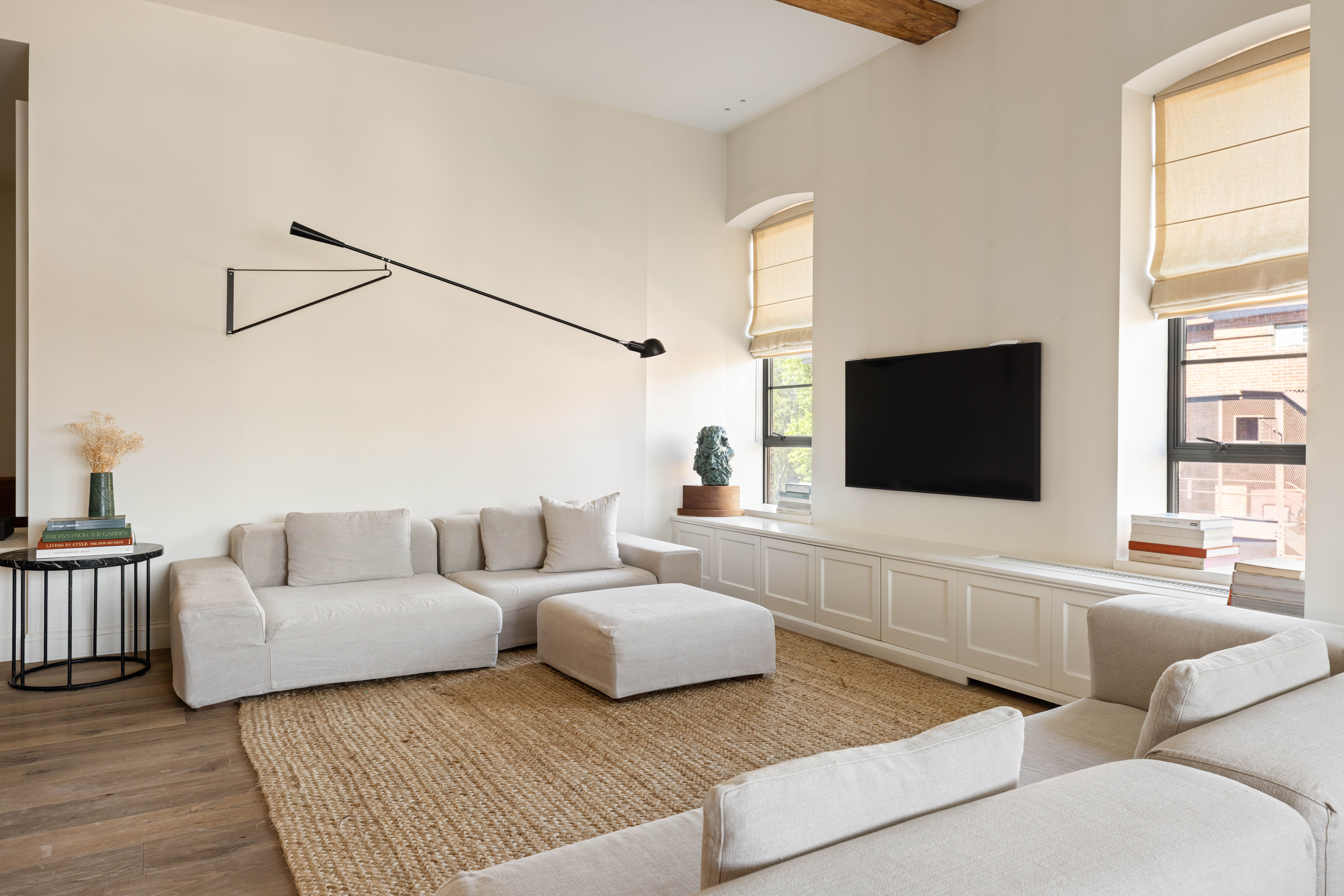 20 Henry Street, Unit 5D/S Brooklyn, NY 11201 - Photo 7 of 15 a living room with furniture and a flat screen tv