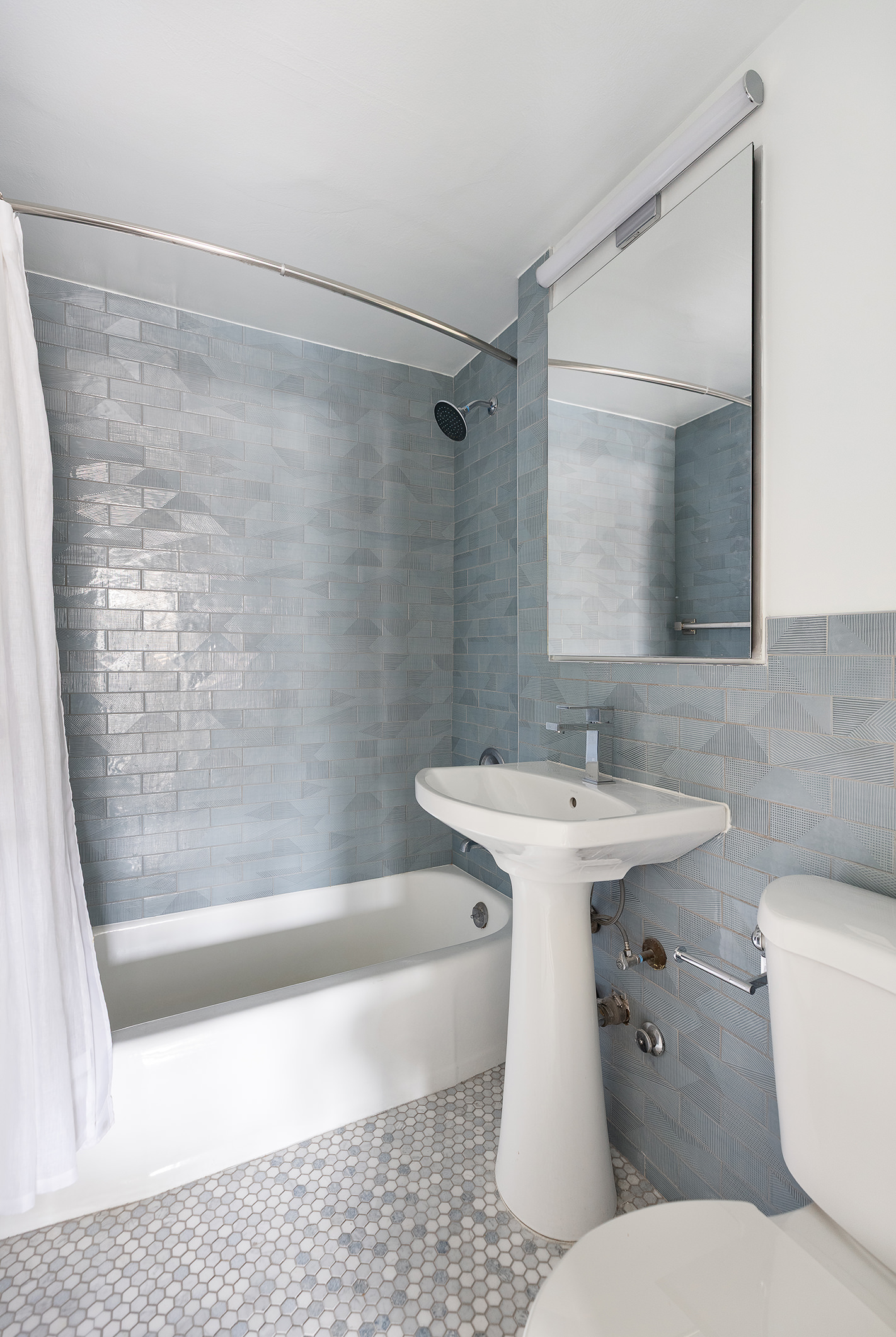 7 East 14th Street, Unit 18X Manhattan, NY 10003 - Photo 6 of 7 a bathroom with a sink toilet and shower