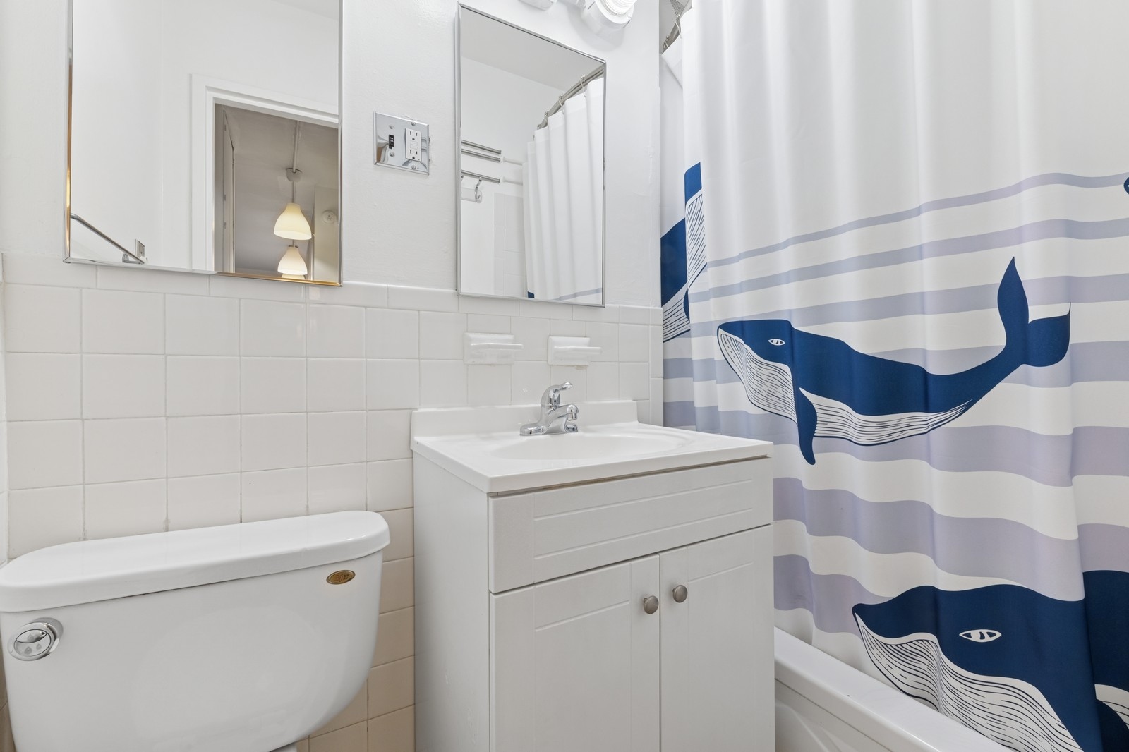 236 East 28th Street, Unit 4C Manhattan, NY 10016 - Photo 4 of 5 a bathroom with a sink toilet and shower