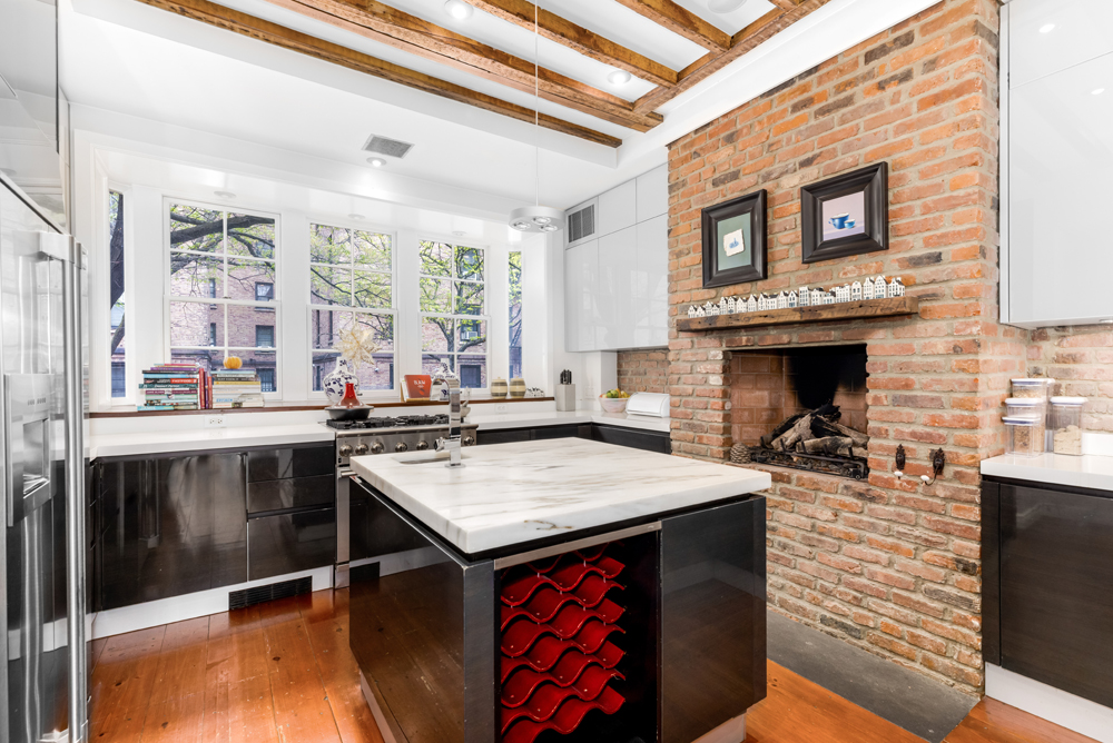 308 West 19th Street, Unit GARDEN Manhattan, NY 10011 - Photo 5 of 18 a kitchen with a sink stove and cabinets