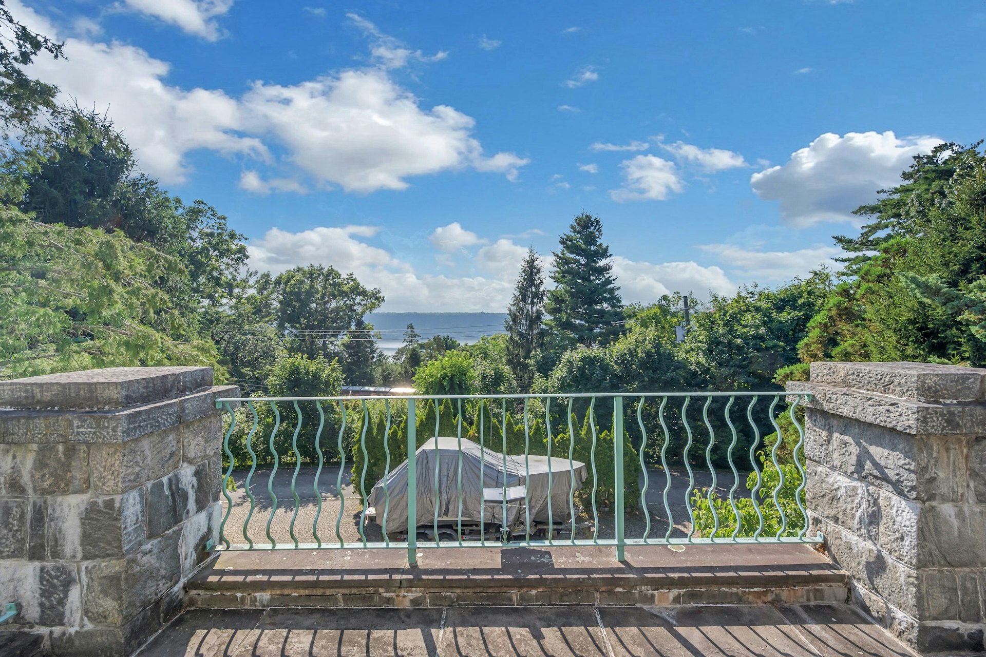 5440 Independence Avenue Bronx, NY 10471 - Photo 33 of 36 a view of a deck with a floor to ceiling fan and trees
