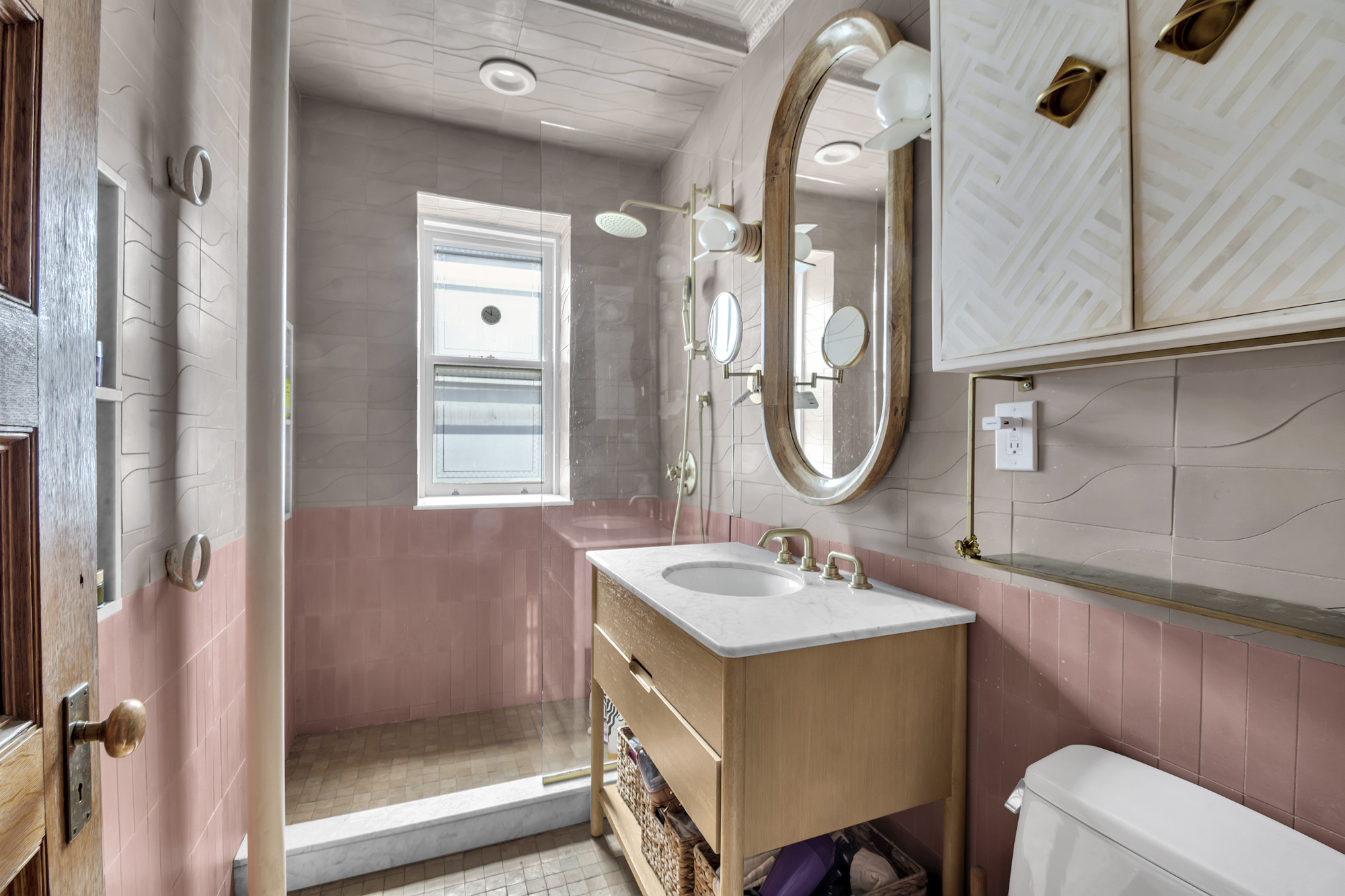 275 Clinton Avenue, Unit 4-1 Brooklyn, NY 11205 - Photo 13 of 20 a bathroom with a double vanity sink mirror and bathtub