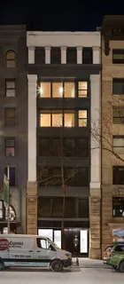 a front view of a building with a street