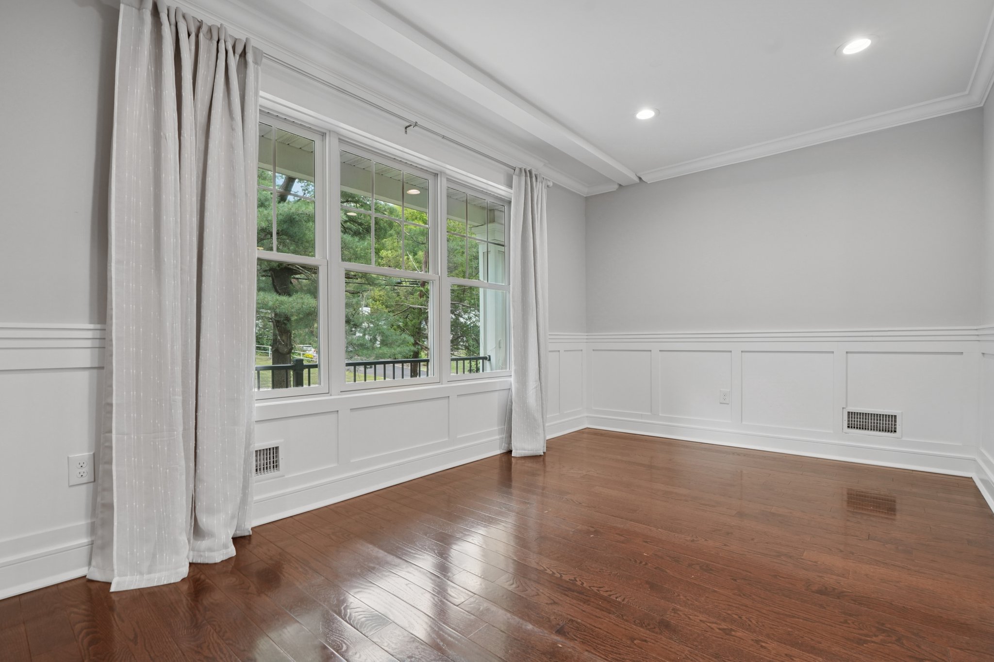 823 River Road Chatham, NJ 07928 - Photo 34 of 60 a view of an empty room with wooden floor and a window