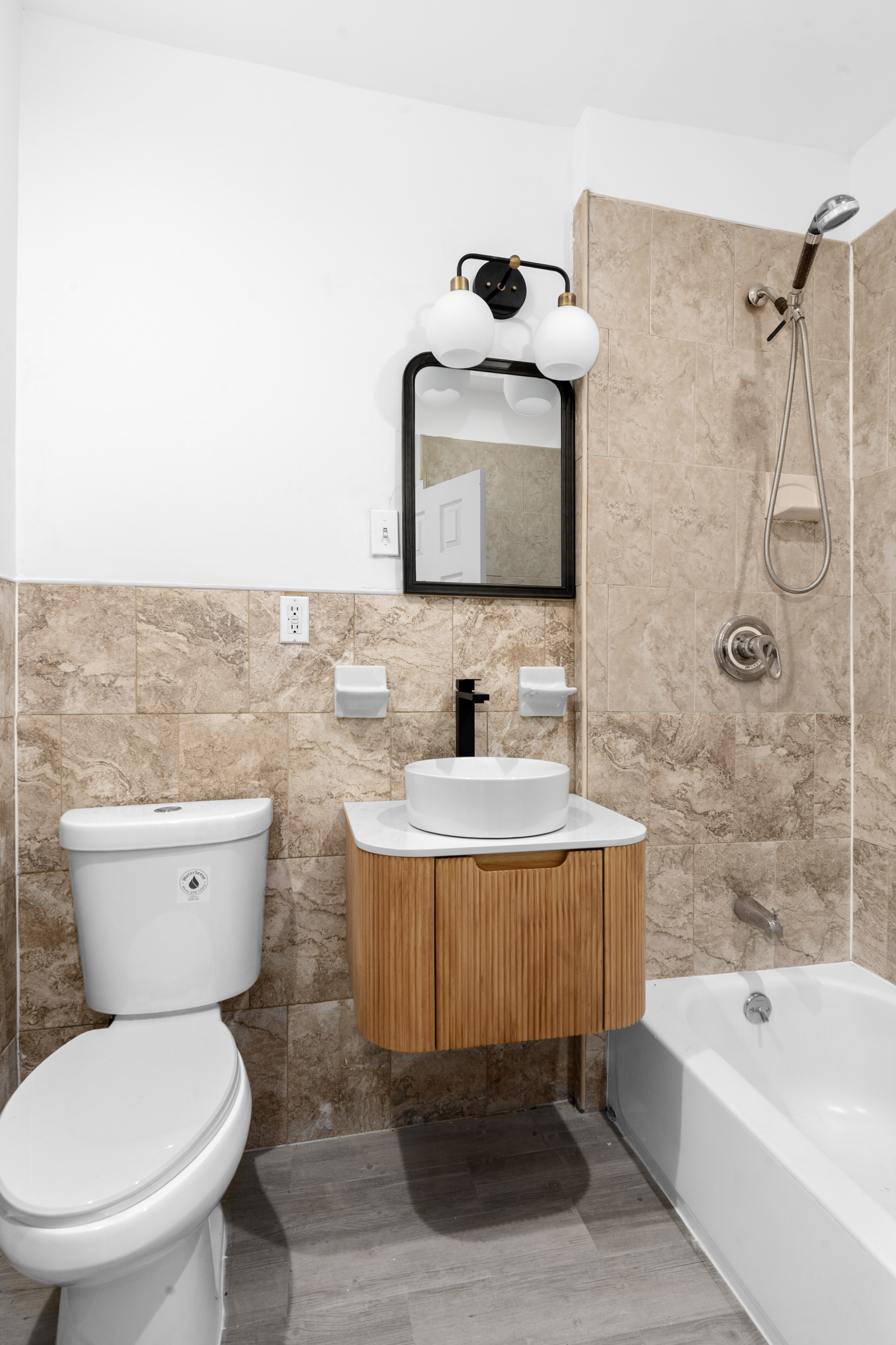 339 East 29th Street Brooklyn, NY 11226 - Photo 18 of 21 a bathroom with a sink a toilet and bathtub