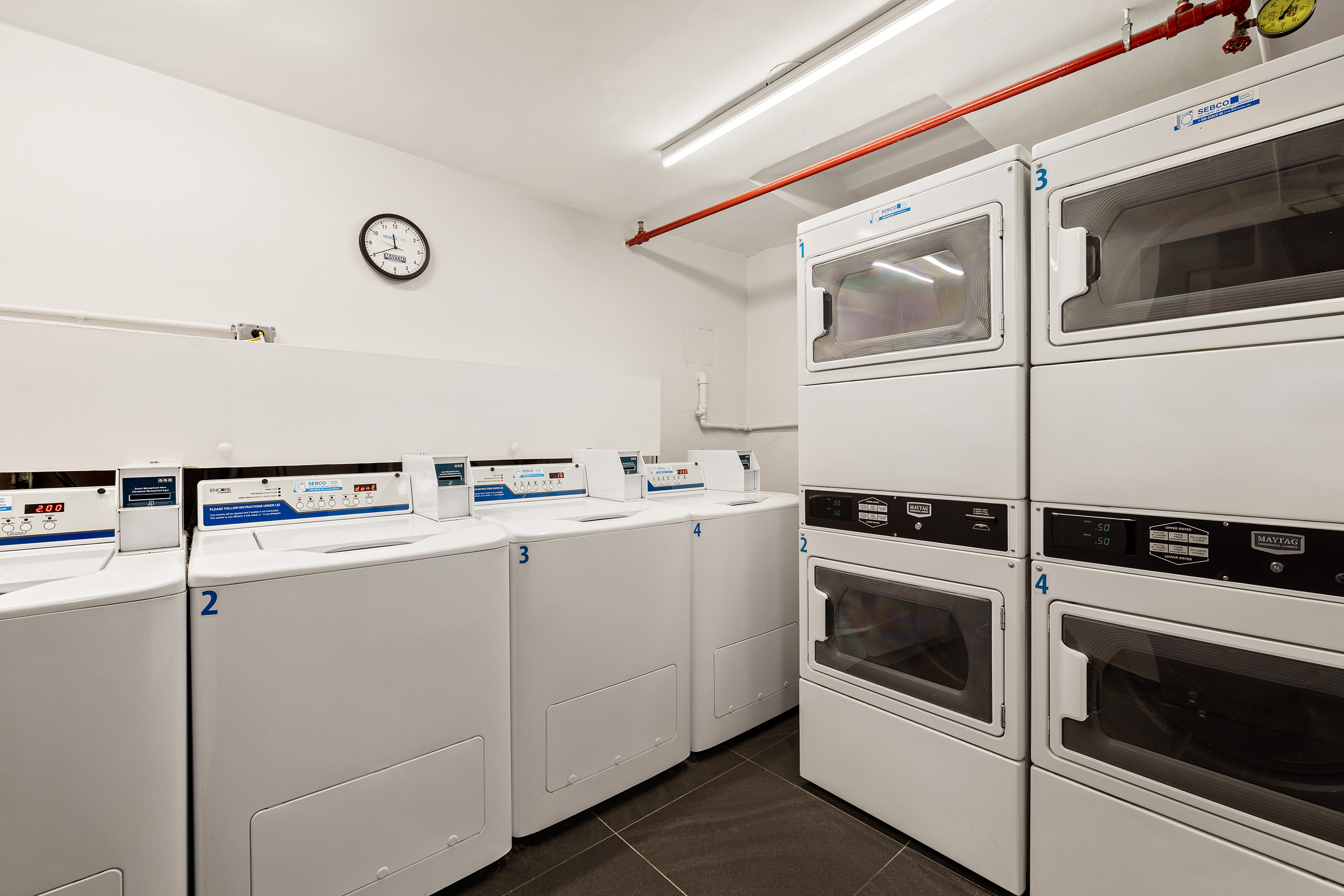 399 Ocean Parkway, Unit 6K Brooklyn, NY 11218 - Photo 8 of 9 a utility room with dryer and washer
