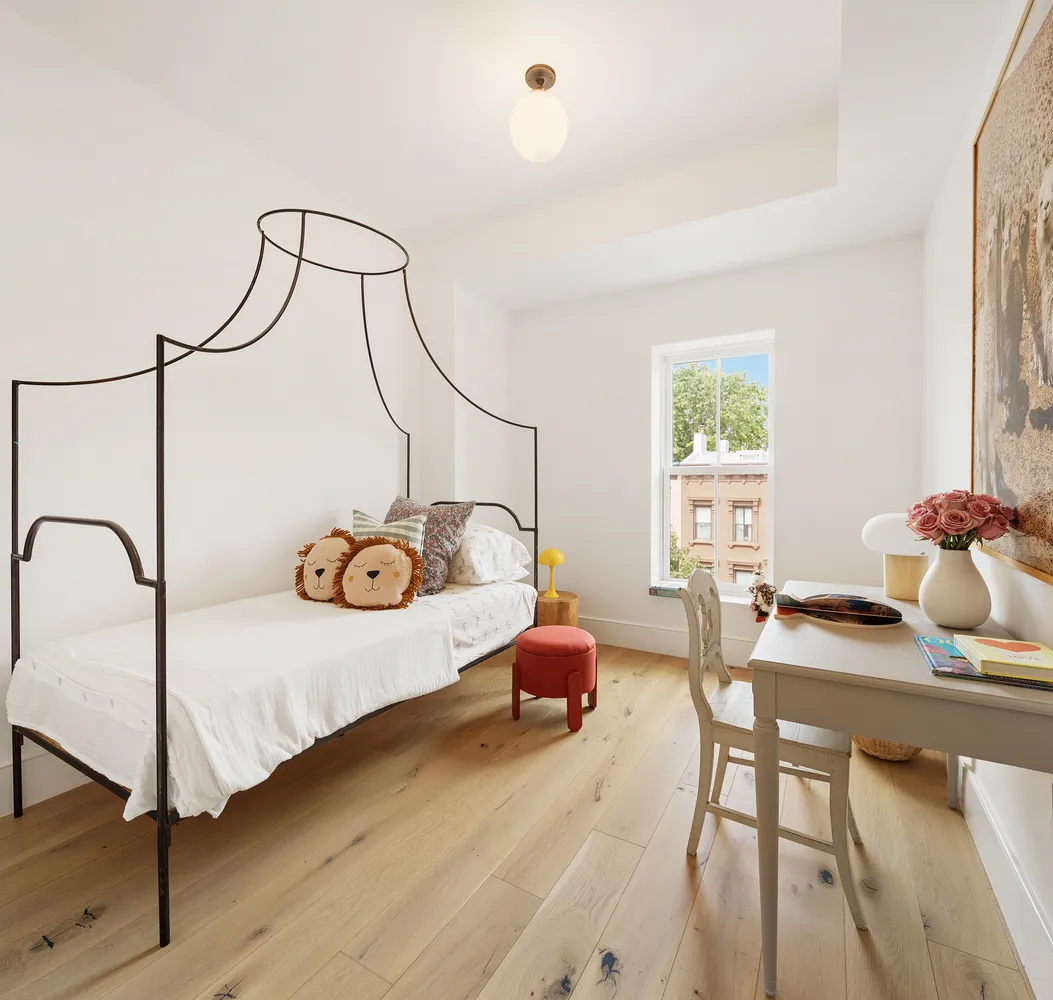 a bedroom with bed and a window