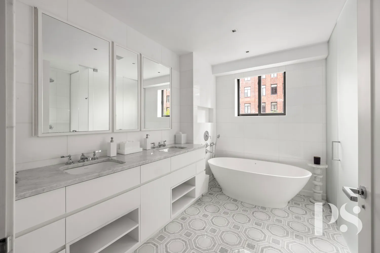 a spacious bathroom with a double vanity sink mirror and bathtub