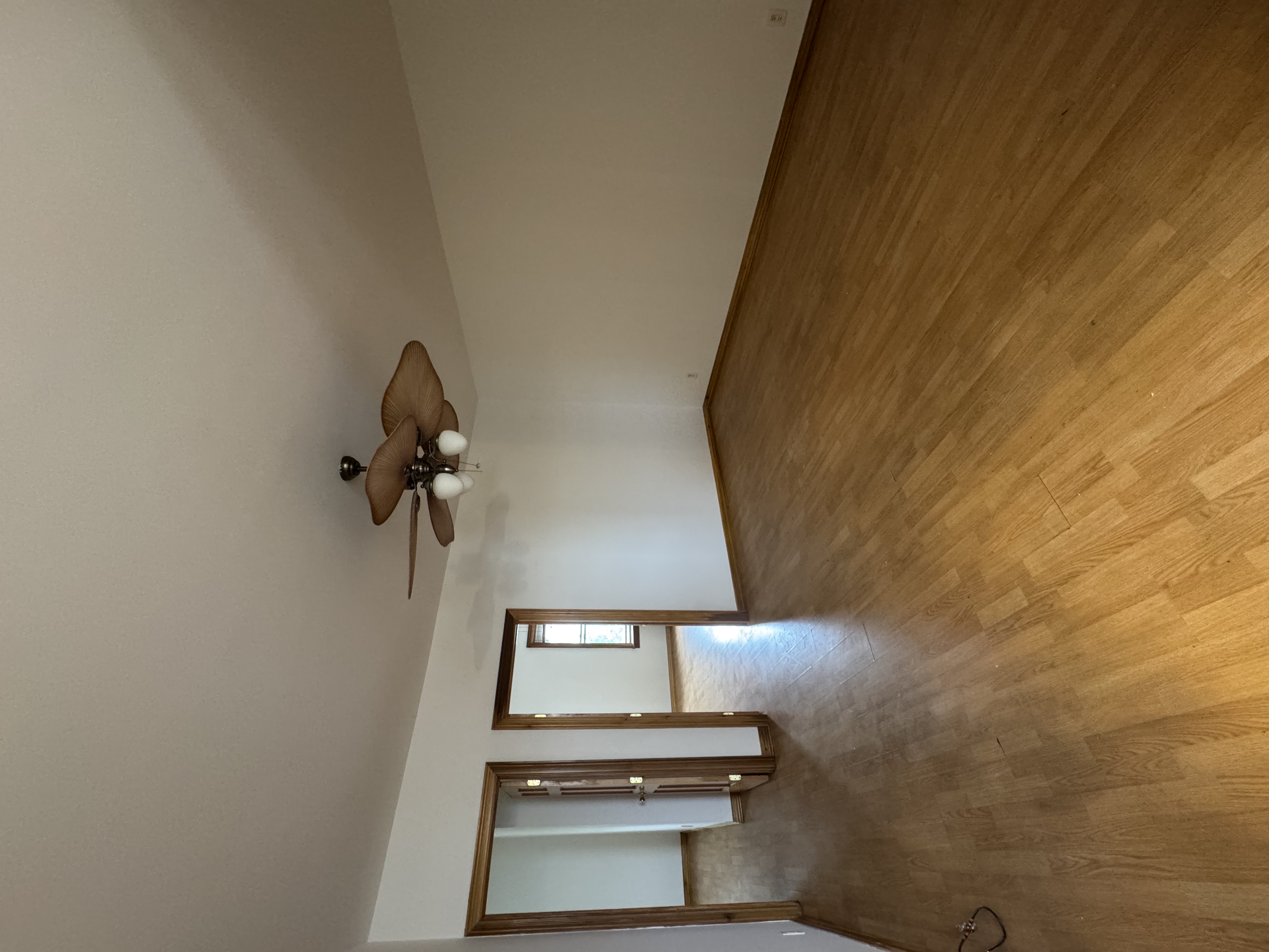 60-27 56th Road, Unit 3 Queens, NY 11378 - Photo 6 of 9 a view of a livingroom with a ceiling fan and window