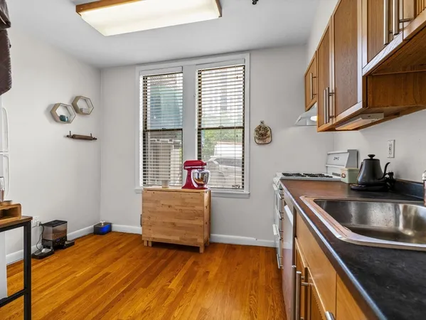 a kitchen that has a sink and a stove
