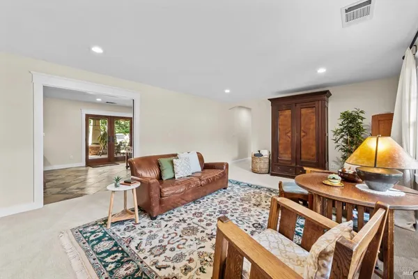 a bathroom with a double vanity sink toilet mirror and shower