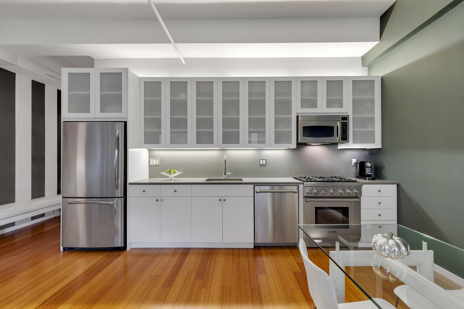 a kitchen with granite countertop a stove and a sink
