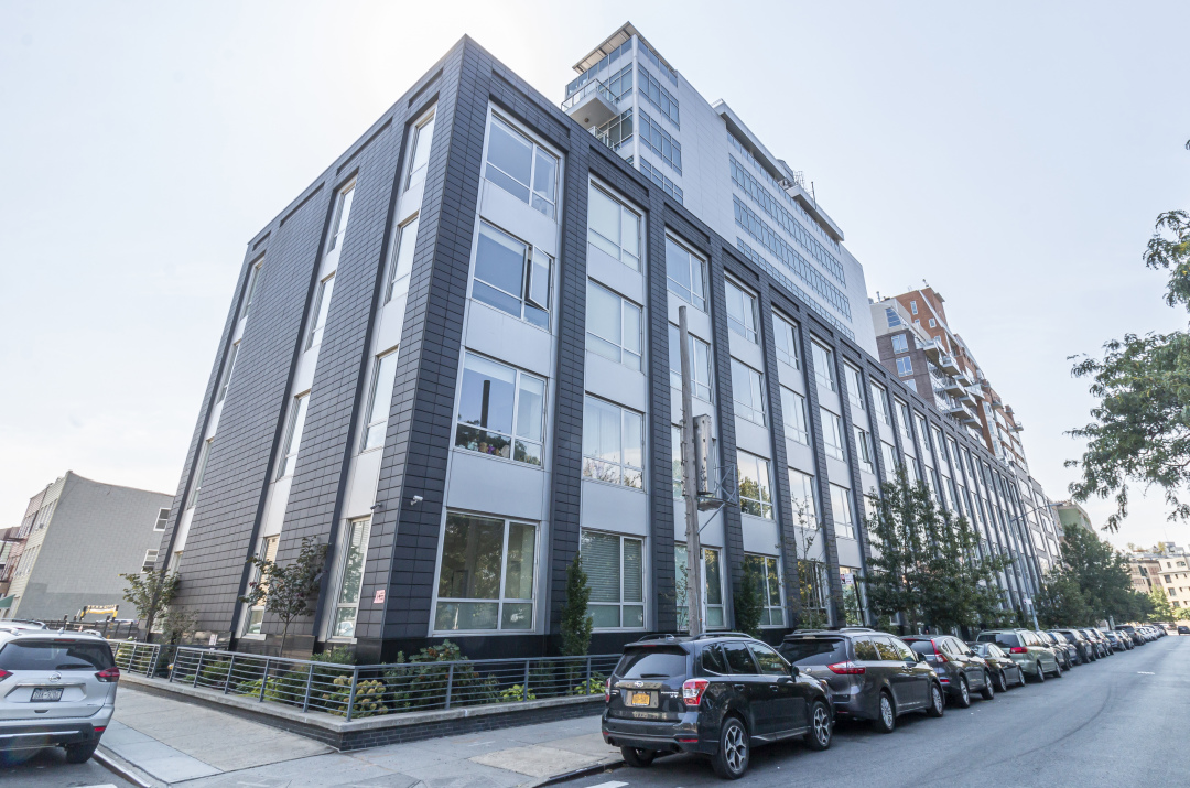 50 Bayard Street, Unit 3J Brooklyn, NY 11211 - Photo 11 of 13 a couple of cars parked in front of brick building
