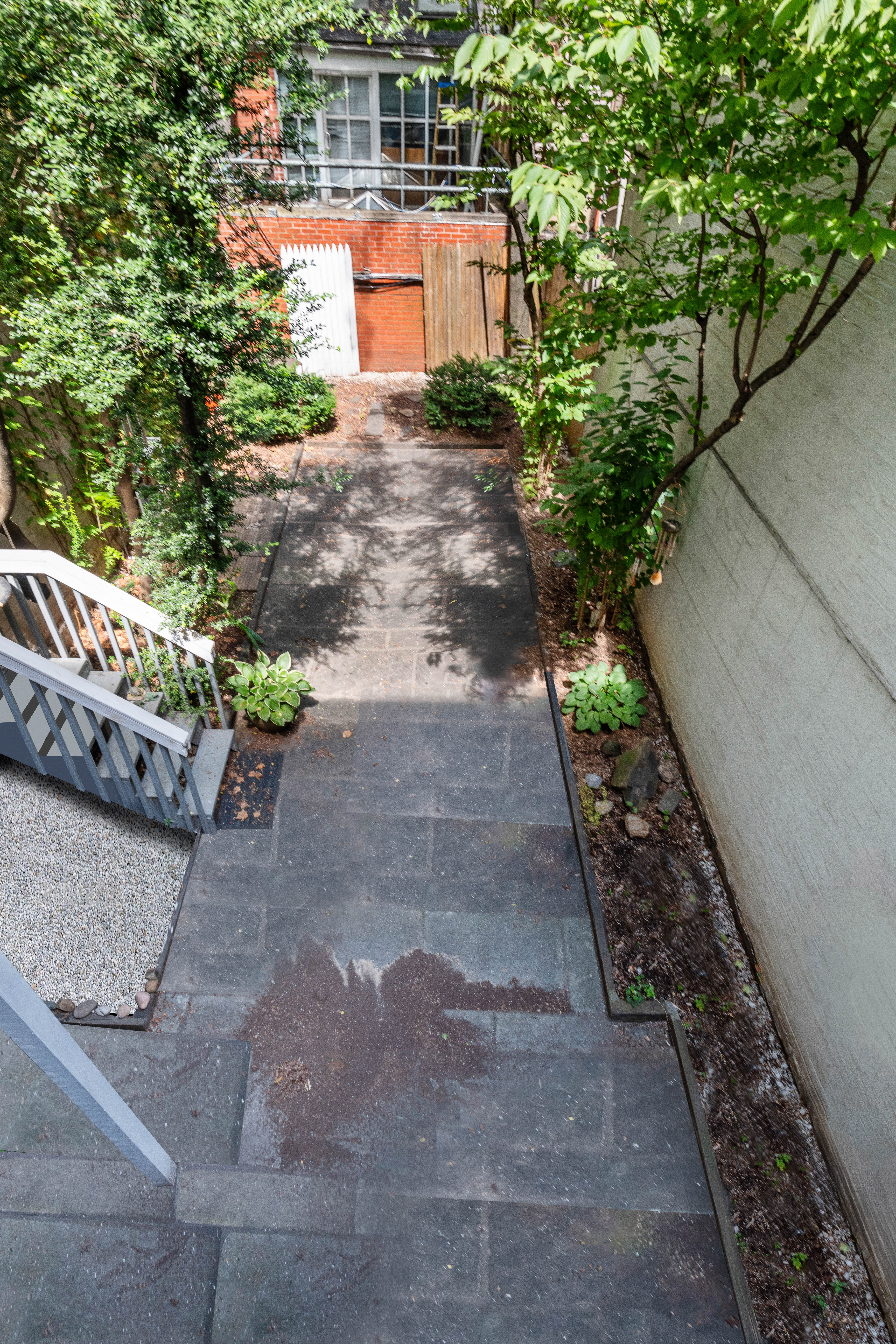 209 East 48th Street Manhattan, NY 10017 - Photo 10 of 13 a view of a yard with potted plants