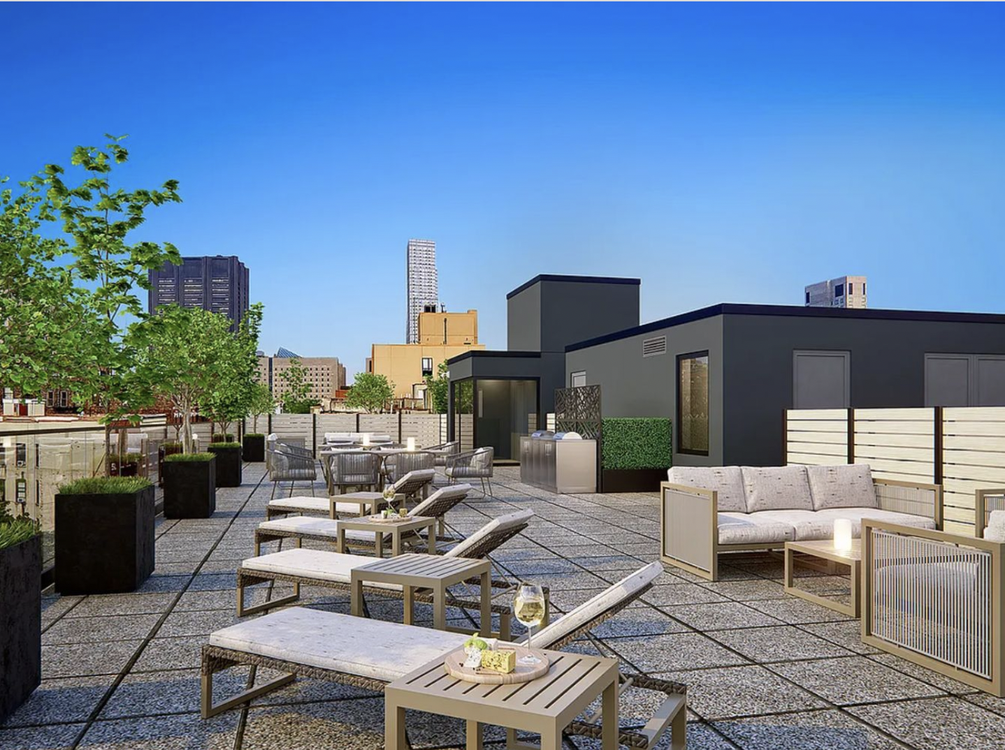 181 East 101st Street, Unit 701 Manhattan, NY 10029 - Photo 14 of 16 a view of a patio with couches table and chairs under an umbrella with a fire pit