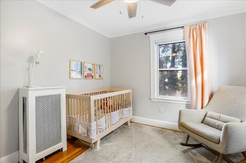a view of a bedroom with furniture and windows