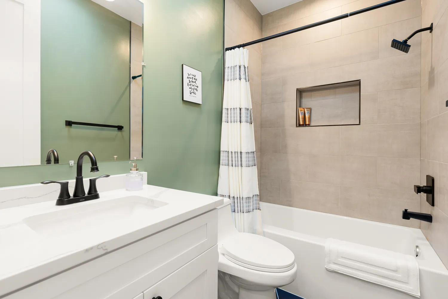 a bathroom with a sink a toilet and a bathtub