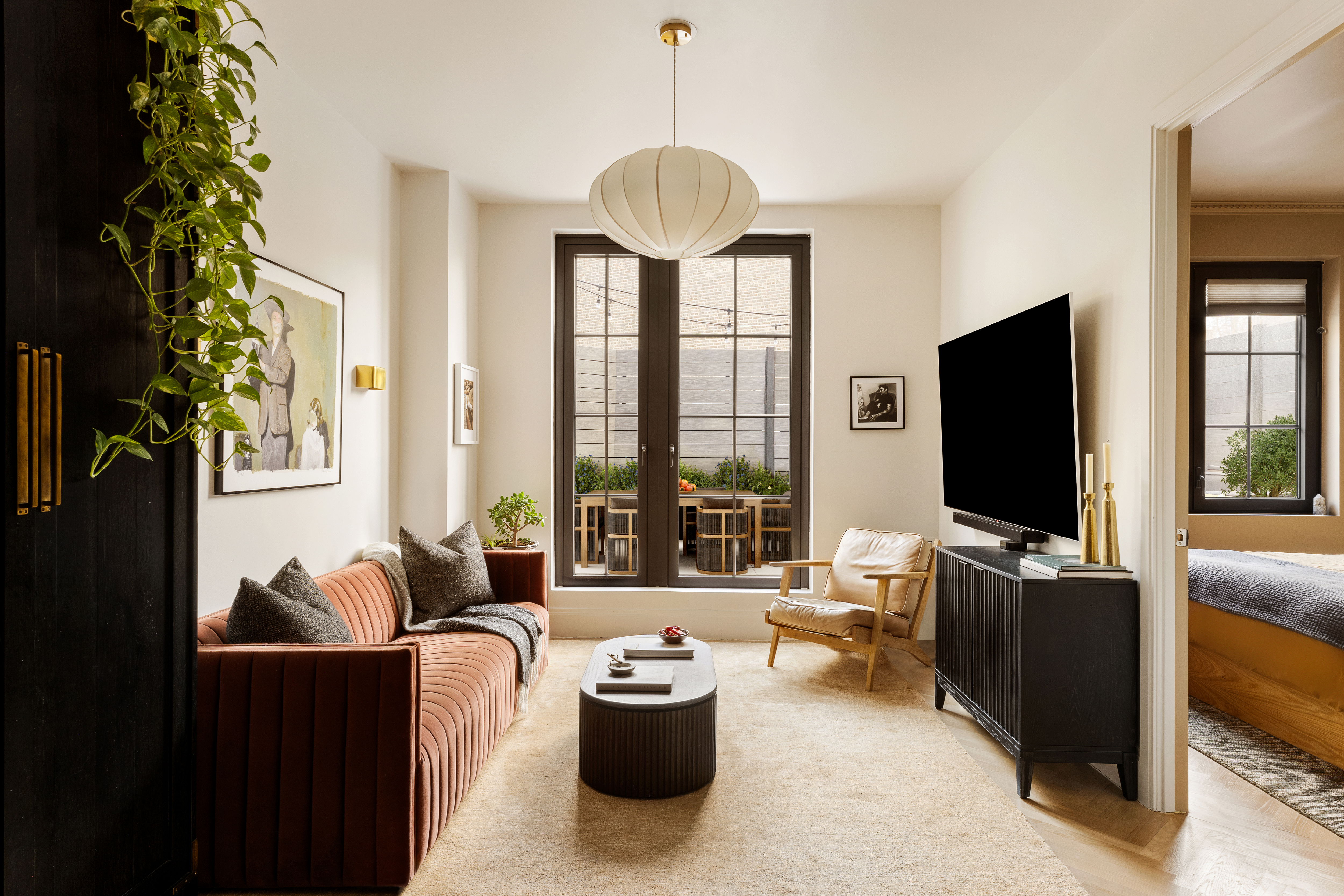 a living room with furniture and a flat screen tv