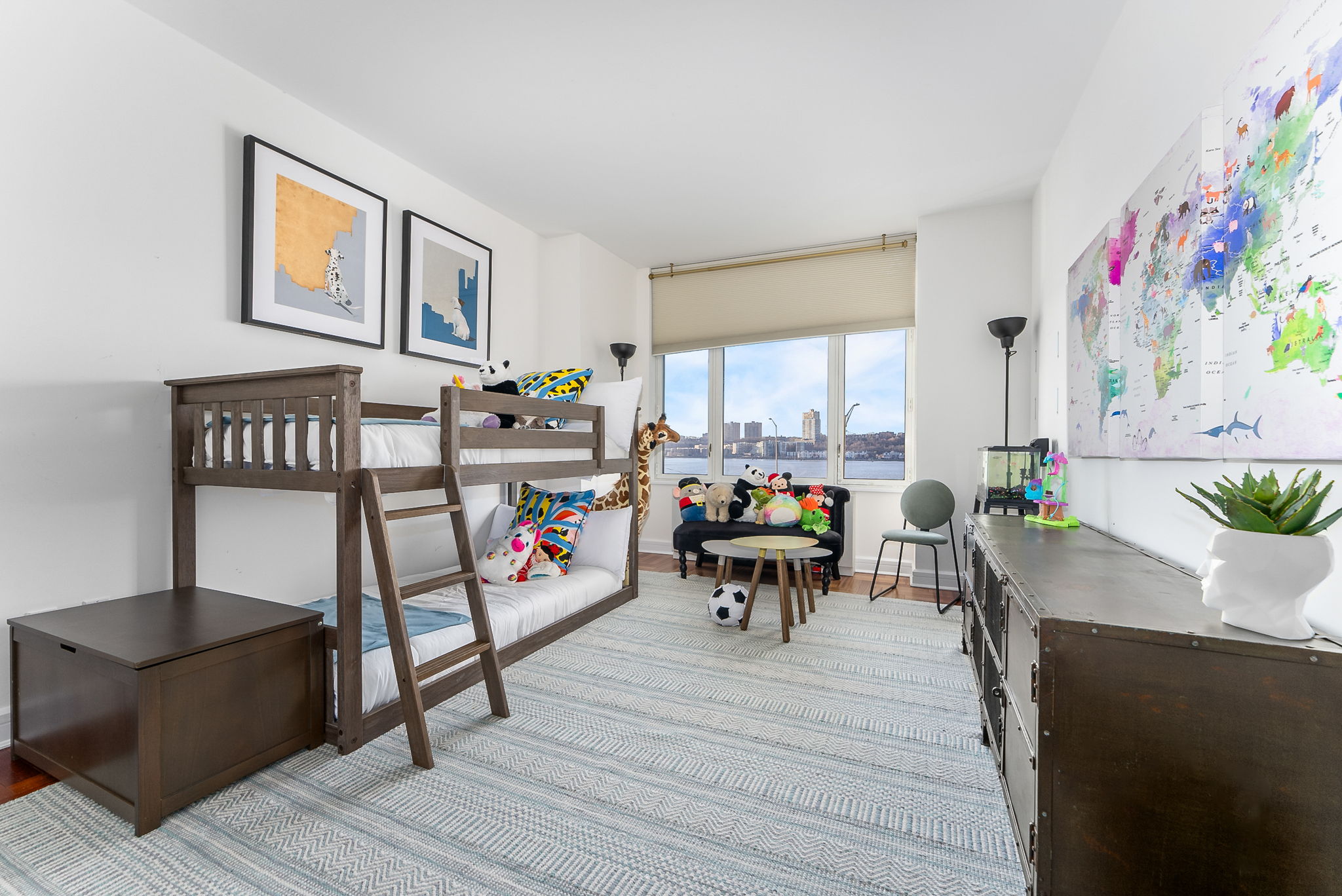 220 Riverside Boulevard, Unit 4M Manhattan, NY 10069 - Photo 8 of 11 a living room filled with furniture and a potted plant
