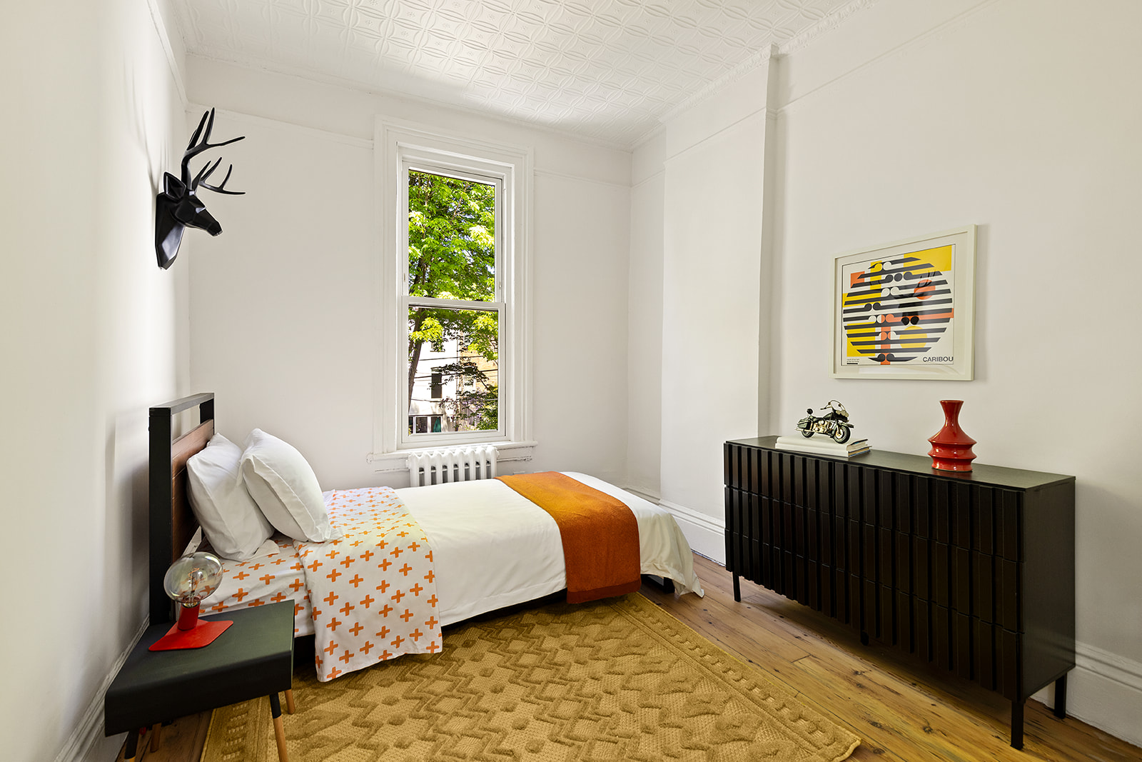 467 11th Street Brooklyn, NY 11215 - Photo 9 of 14 a bedroom with a bed and a window