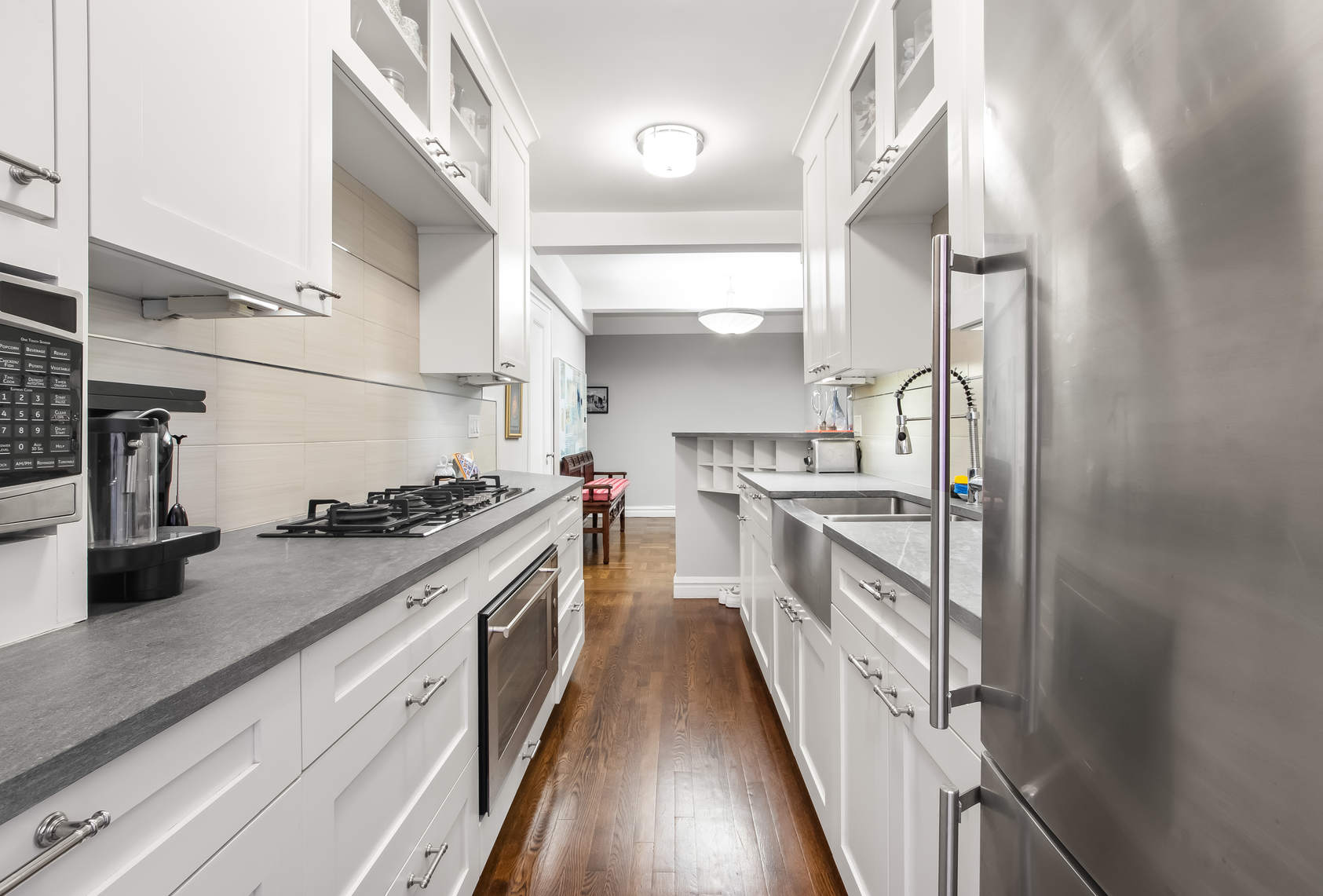 565 West End Avenue, Unit 3C Manhattan, NY 10024 - Photo 8 of 15 a kitchen with stainless steel appliances granite countertop a stove and a sink